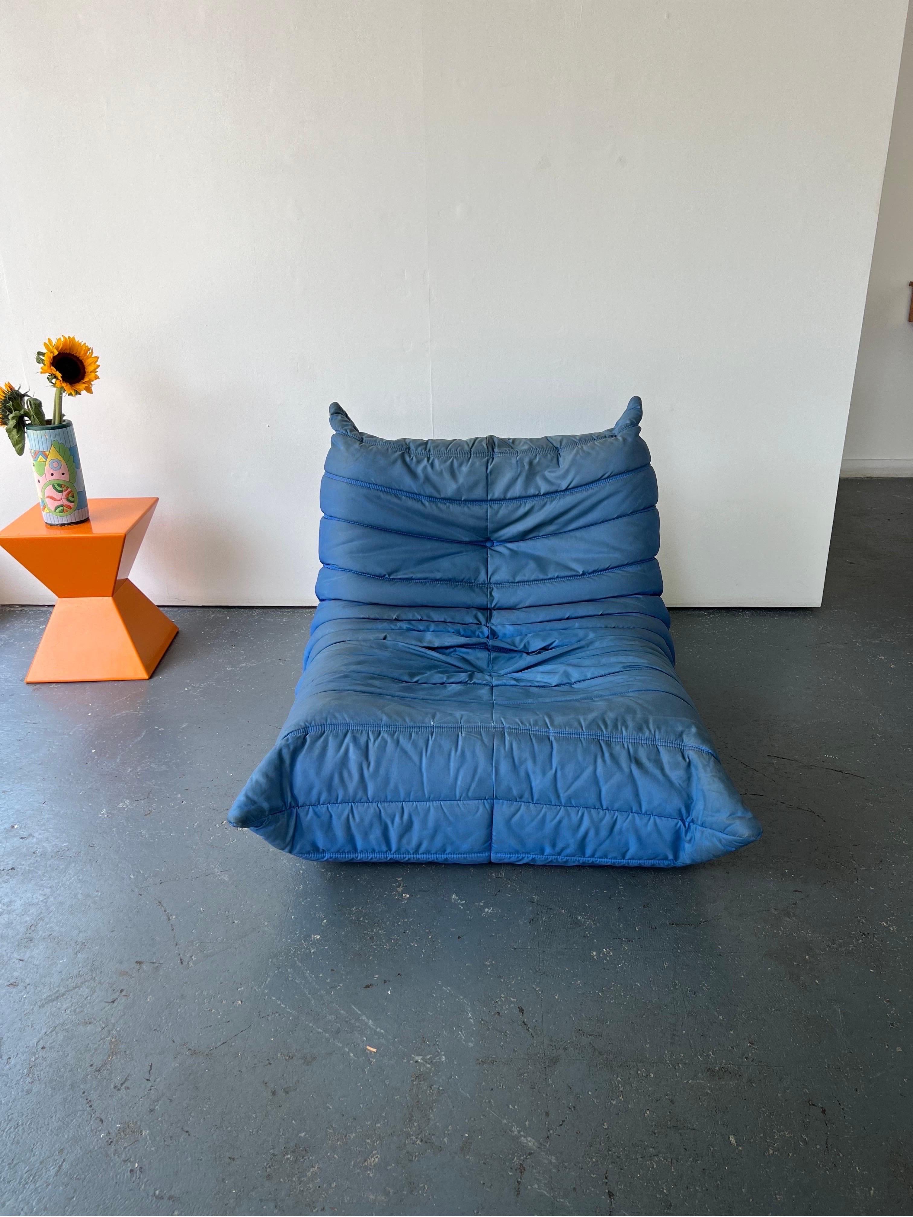 Fabulous blue Nylon fireside single Togo sofa by Michael Ducaroy for Ligne Roset. A comfortable and classic design in a super rare cover. The Nylon is a very contemporary finish. 

100% authentic with the stripe pattern underneath and Ligne Roset