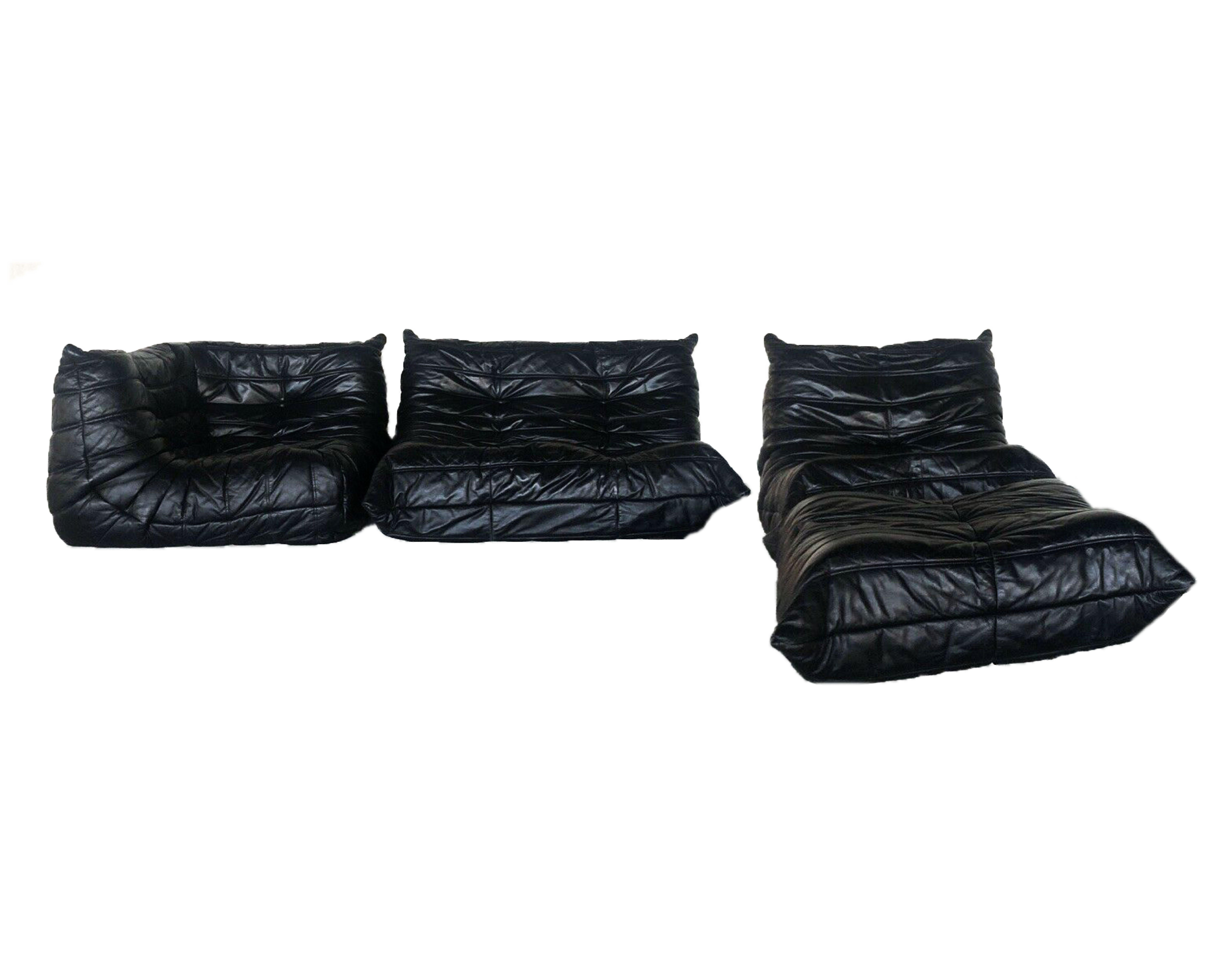 Ligne Roset Togo modular sofa set in black leather by Michel Ducaroy 1970s, Custom.
MSRP 24,000 + USD. One corner, one lounge chair, one ottoman and one two-seat sofa.