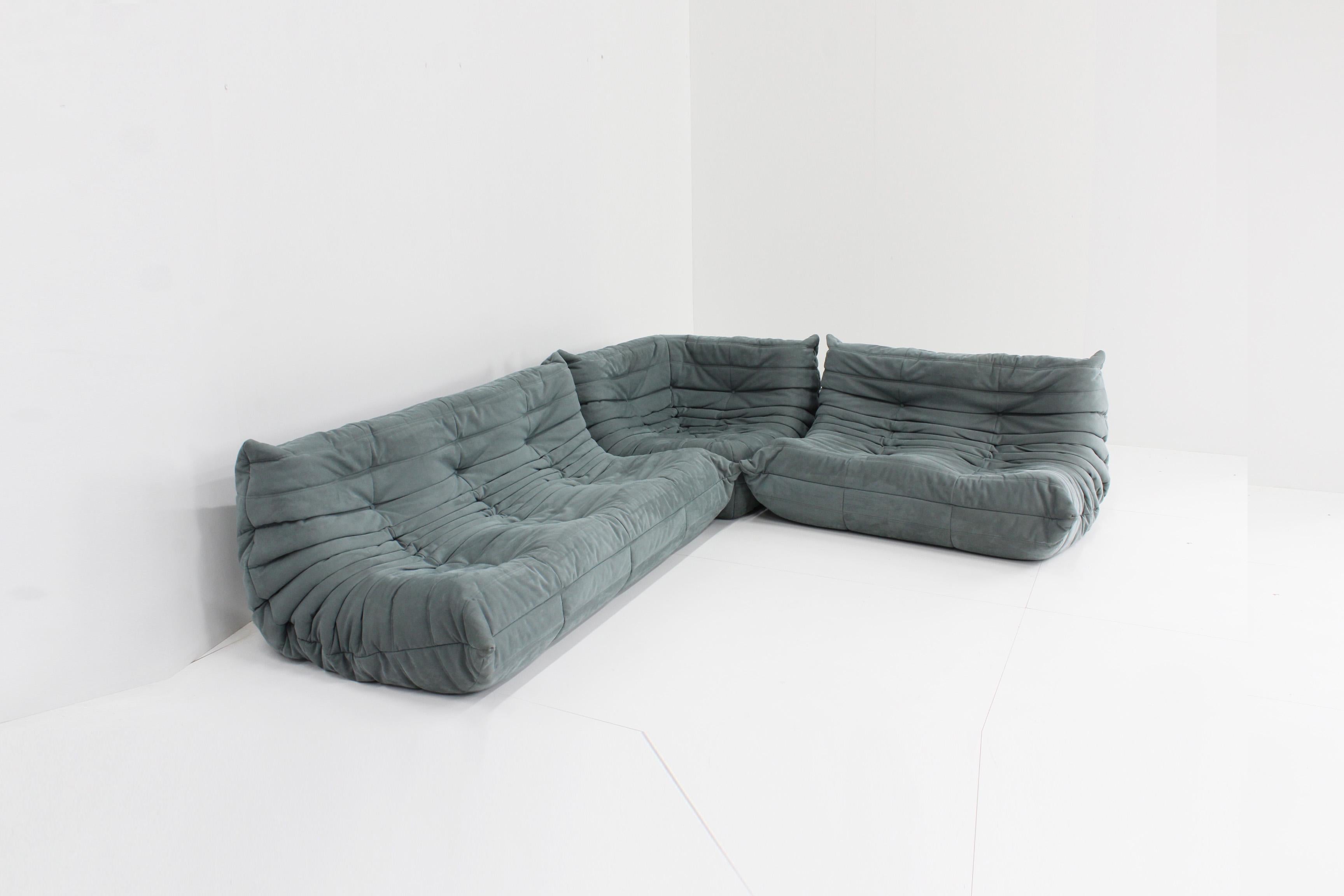 Original Togo sofa set by Ligne Roset designed by Michel Ducaroy. This is an original set from 2015 in alacantra. The color is light grey but has a tinge of blue in it. On the ligne Roset site this is colour code ‘baby grey'. The set consists of a 3
