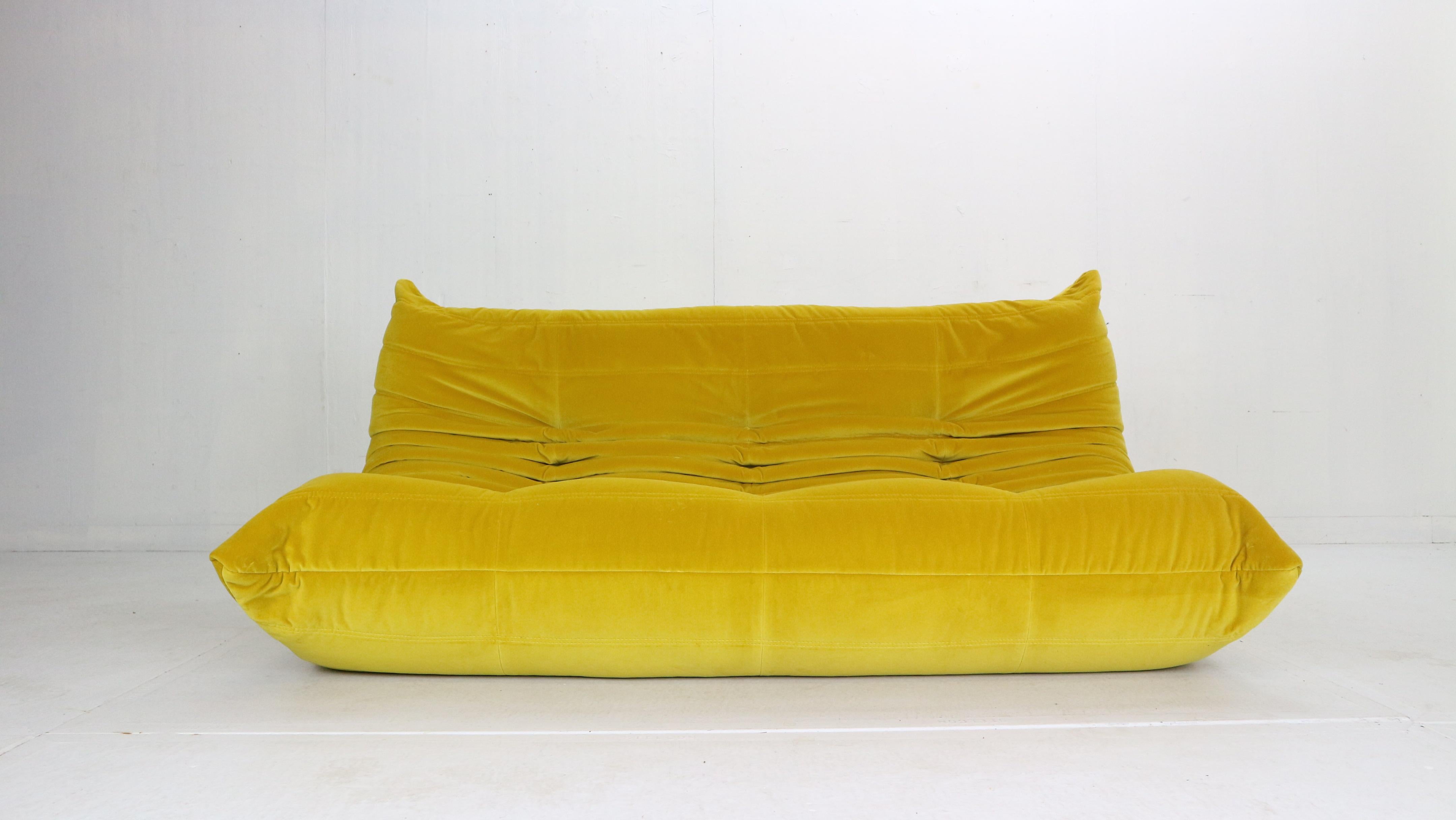 Magnificent Togo three seater lounge sofa designed by Michel Ducaroy in 1973 and was manufactured by Ligne Roset in France.
Very comfortable and beautiful accent to your living room space.
It has been newly reupholstered in a yellow soft velvet