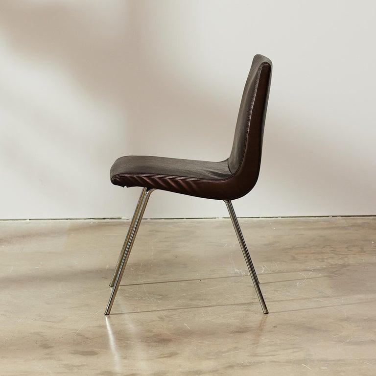 A mid century chair design, by Pierre Paulin from 1952. The  Ligne Roset re-edition respects the original design by makes it current with its larger proportions. Despite its pure simplicity in form, the foam seat and back provides astonishing levels
