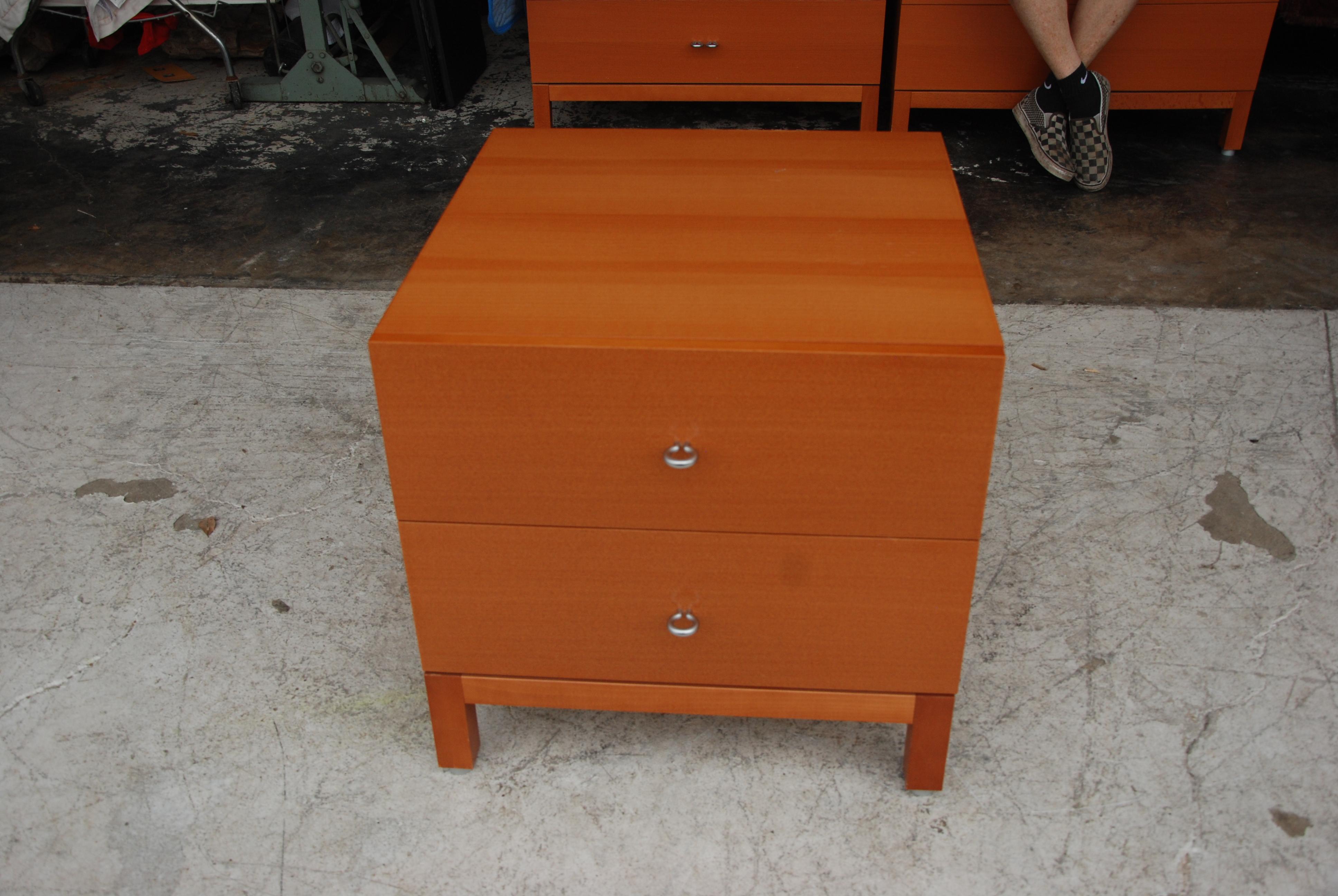 Modern pearwood nightstand

 In warm pearwood with brushed nichol pulls. Features 2 drawers.
Measure: 29.5