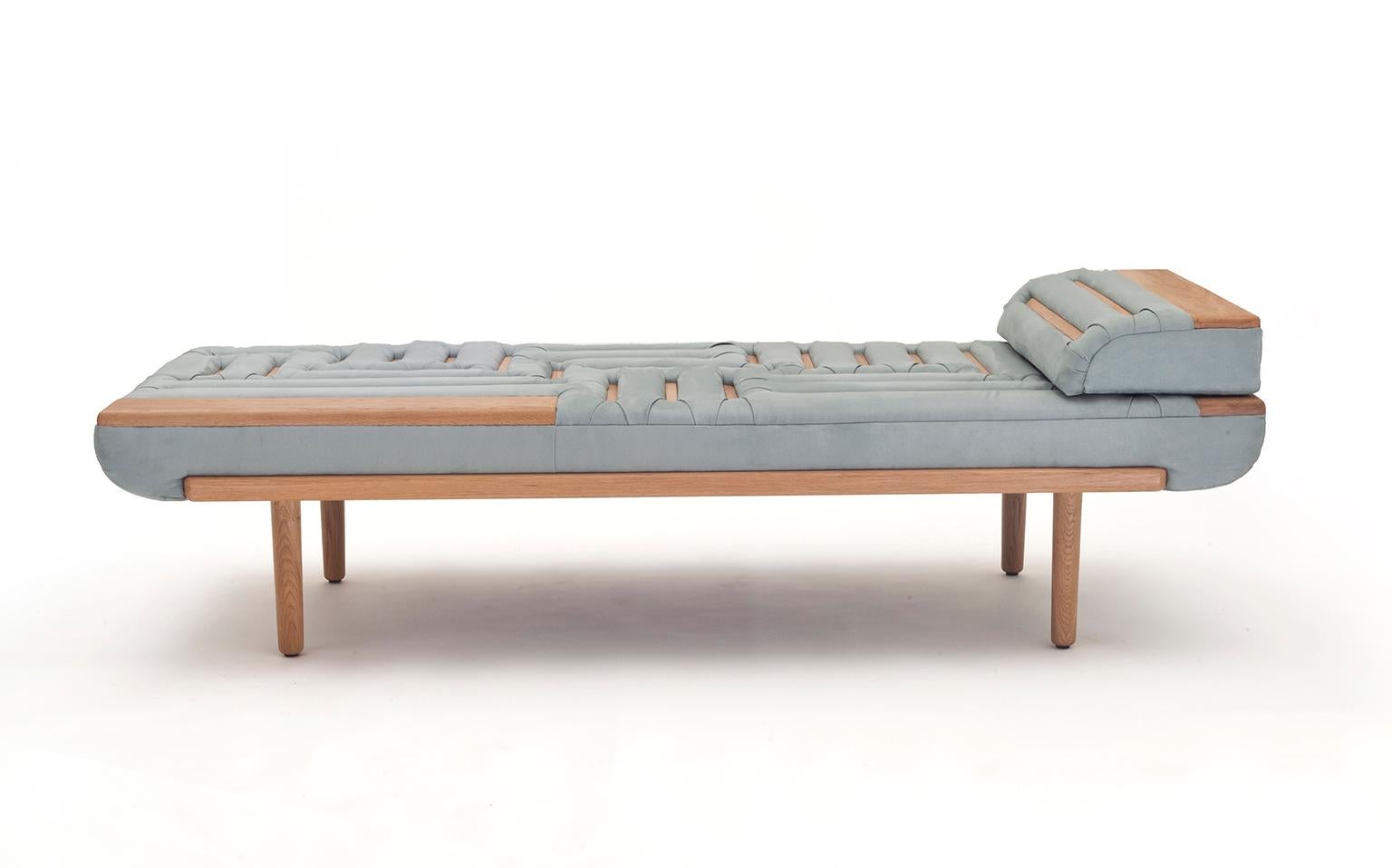 Lignes de Capiton presents a fresh and innovative take on the traditional upholstery technique of Capitonnage – button sofa. Thin, elongated wood beams replace the common buttons that pin-down the cushioned fabric, creating a surprisingly