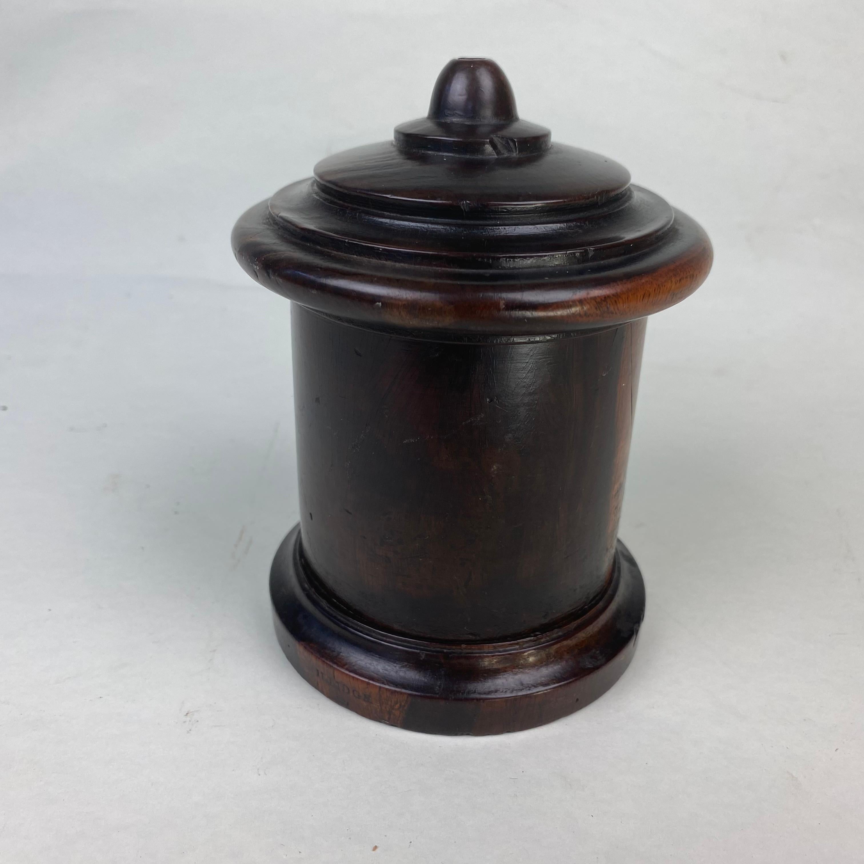 A good treen, turned Lignum Vitae String Box.  The moulded lid with carved threaded srew top lid above a cylindrical body.  Good original condition 
