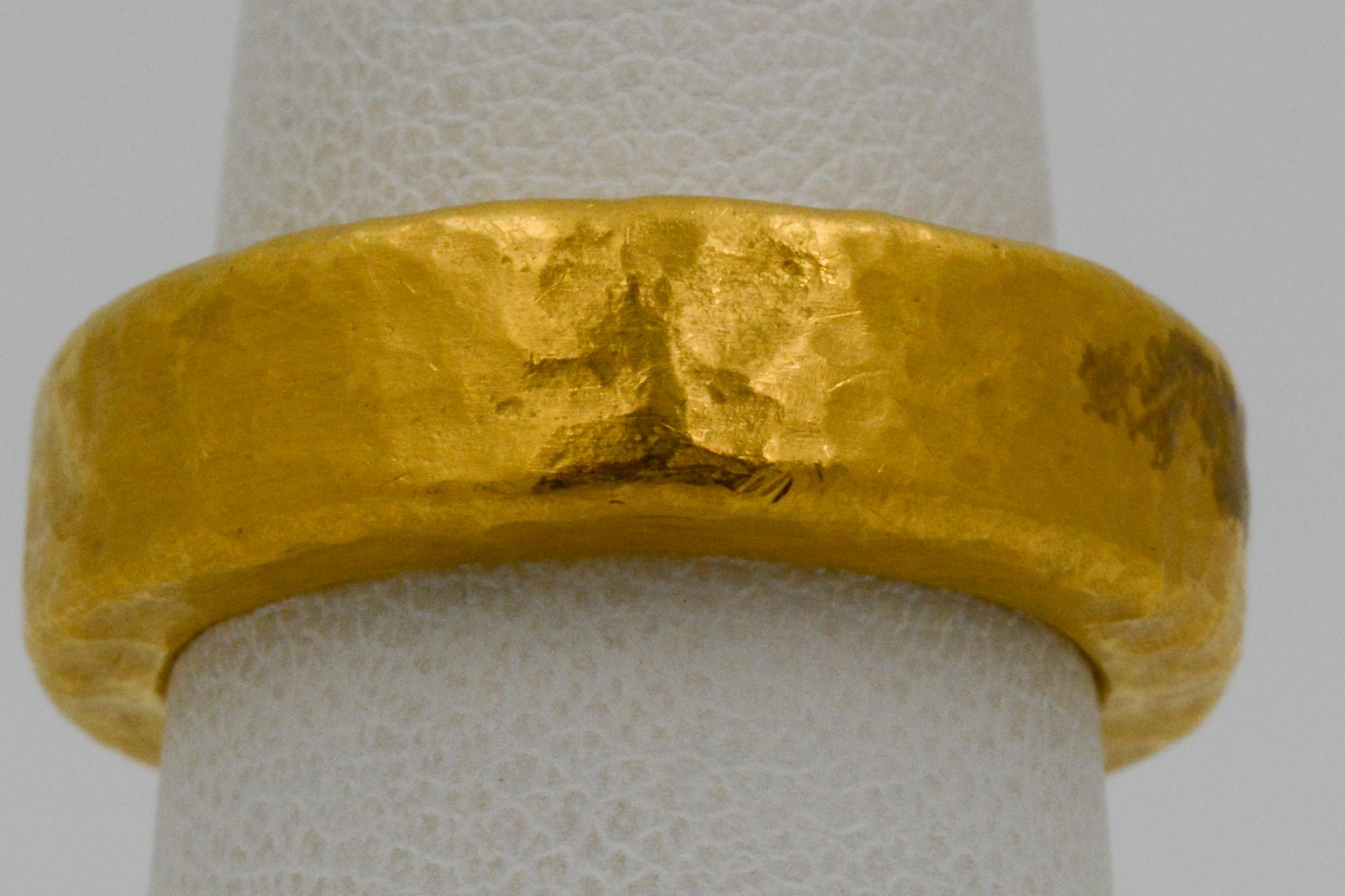 This Lika Behar thick band has the signature 24k yellow gold hammered style, measuring at 6mm. The band also features square edges. The ring is a size 6. 