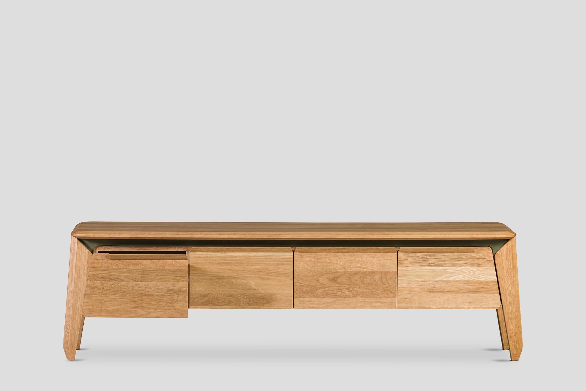 Solid wood oak table and carriers are enriched with metal details.

Features:

– Material: Solid wood oak table and carriers, anthracite metal details

– Designer: Abra (Başak Bakkaloğlu and Cemal Cem Çobanoğlu)

This TV Unit combines functionality