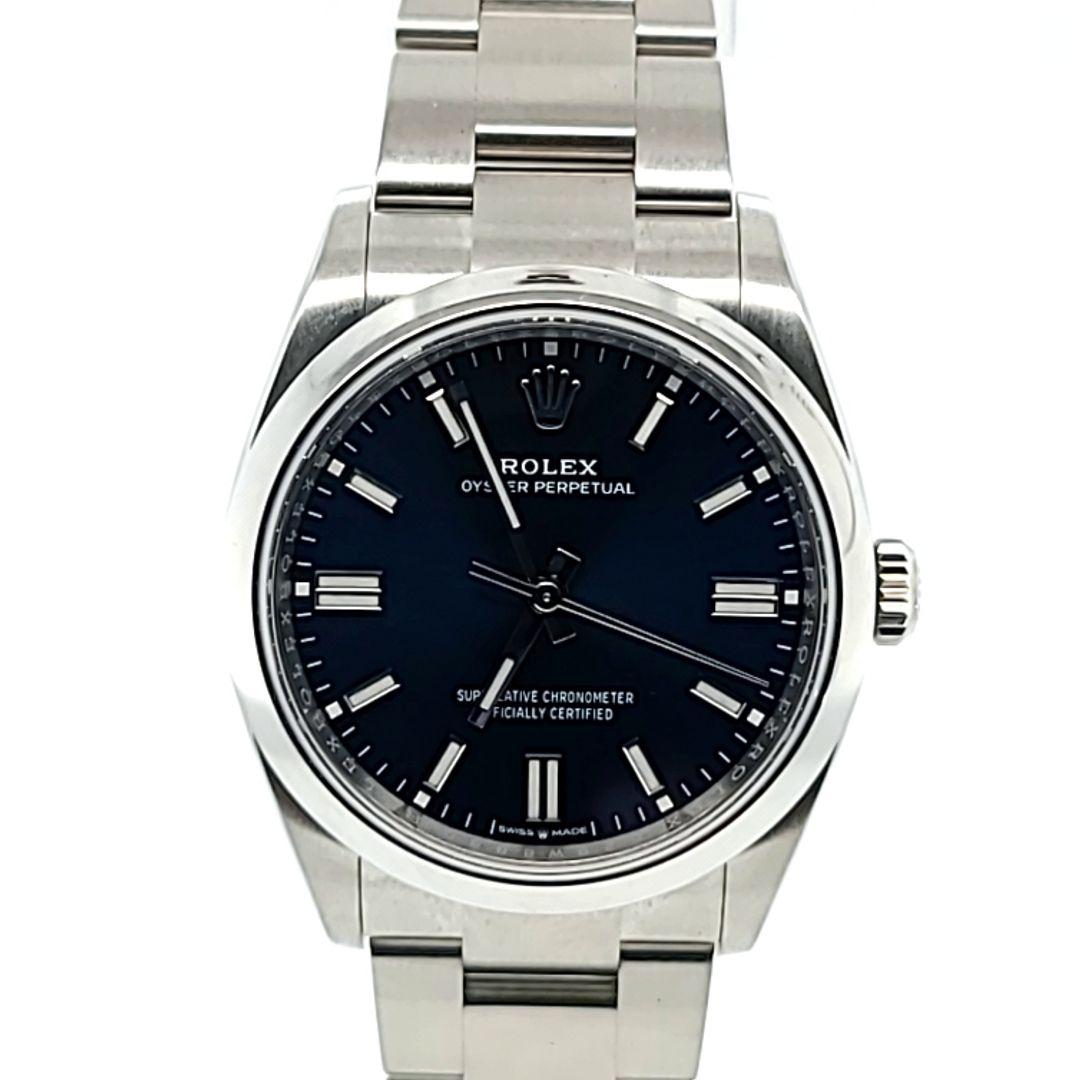 Pre-Owned Like New Rolex Oyster Perpetual 36mm Automatic Watch Crafted in Stainless Steel with Blue Dial. Model 126000 Includes Box, Booklets, July 2023 Warranty Card, & Tag.