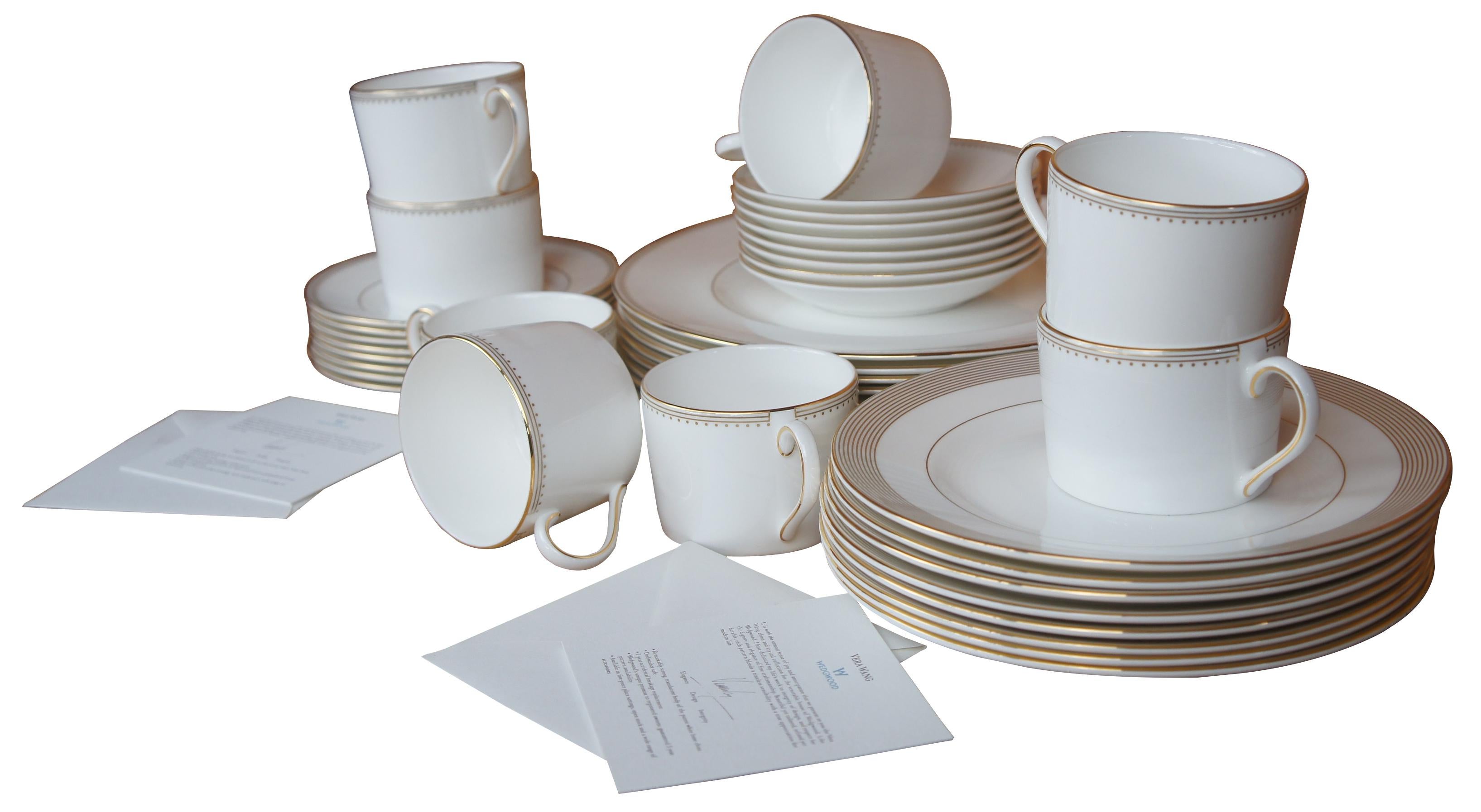 Beautiful 40 piece china set, ‘Golden Grosgrain’ pattern by Vera Wang from Wedgwood China. Set includes place setting for 8, tea/coffee cups, saucers, bread plates, salad plates and dinner plates.

Measures: 8 cups- 3.25