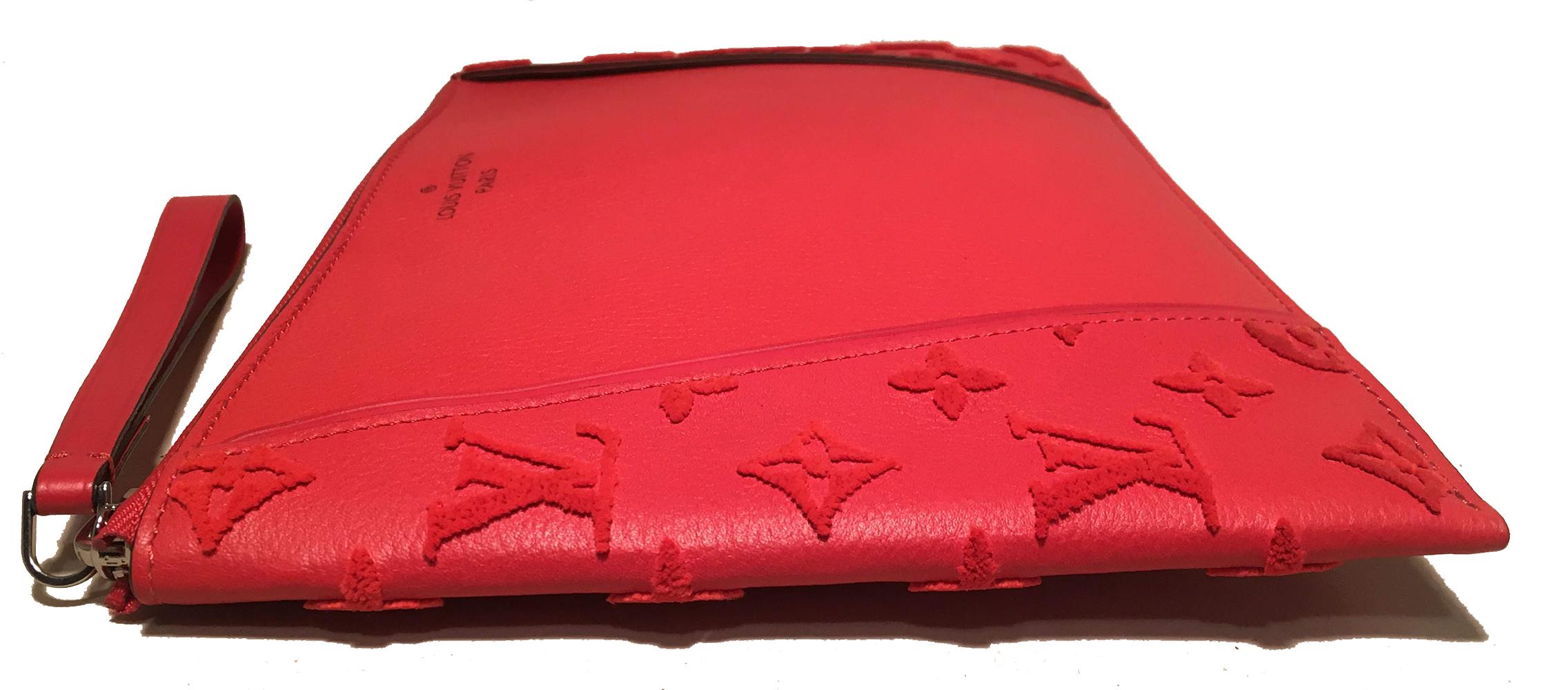 Like New LOUIS VUITTON Monogram Veau Cachemire W Pochette in Framboise Wristlet Clutch in mint condition. Red leather exterior with red velour monogram along sides. Top zipper closure with red leather wrist strap. black leather interior with 6 card