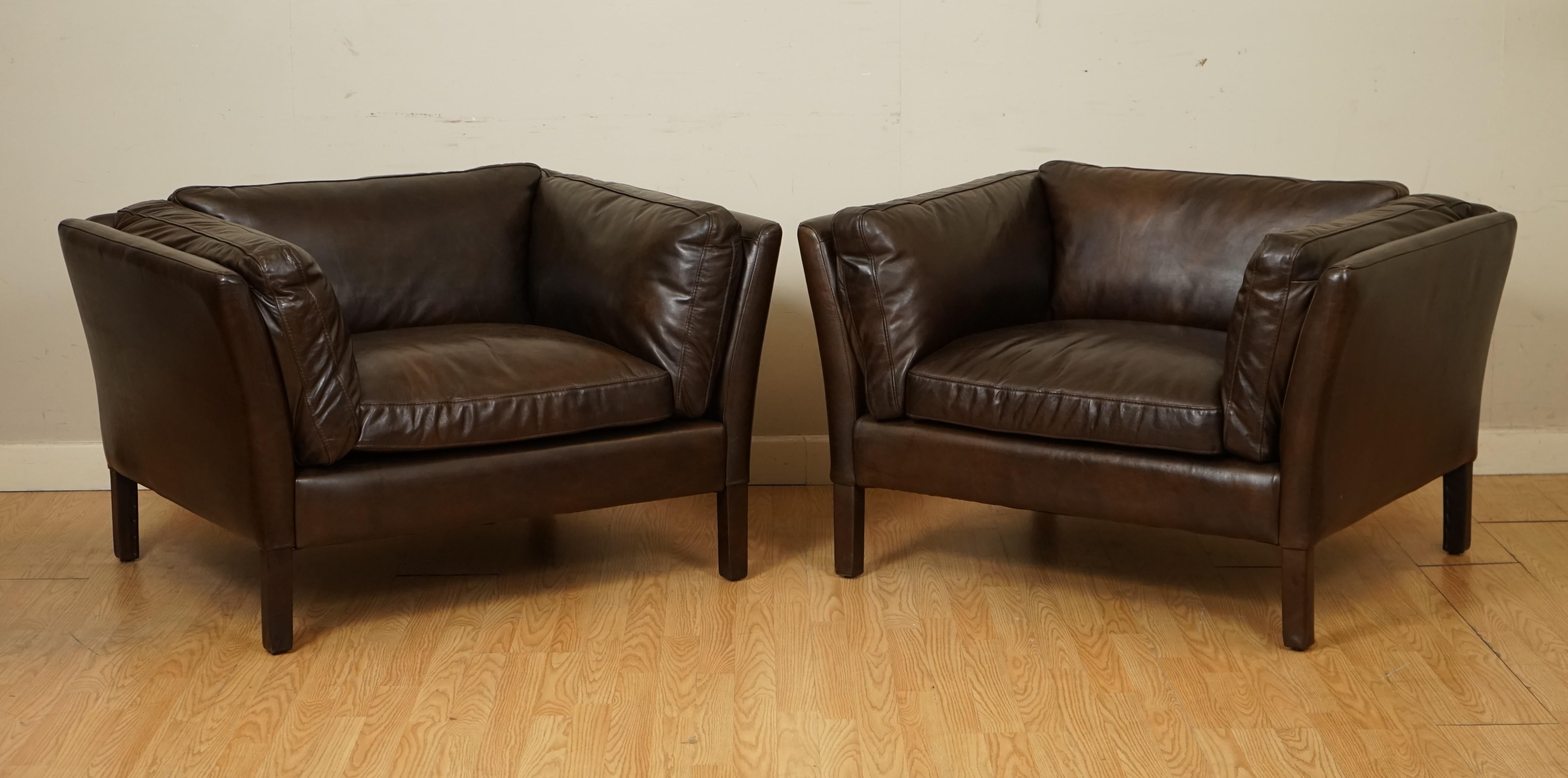 We are so excited to present to you this Pair of Halo Groucho Club Chairs in Biker Tan Colour.

This pair are in an almost like new condition, the leather is in a very good condition and the cushions are still nice and plump.

The seating and