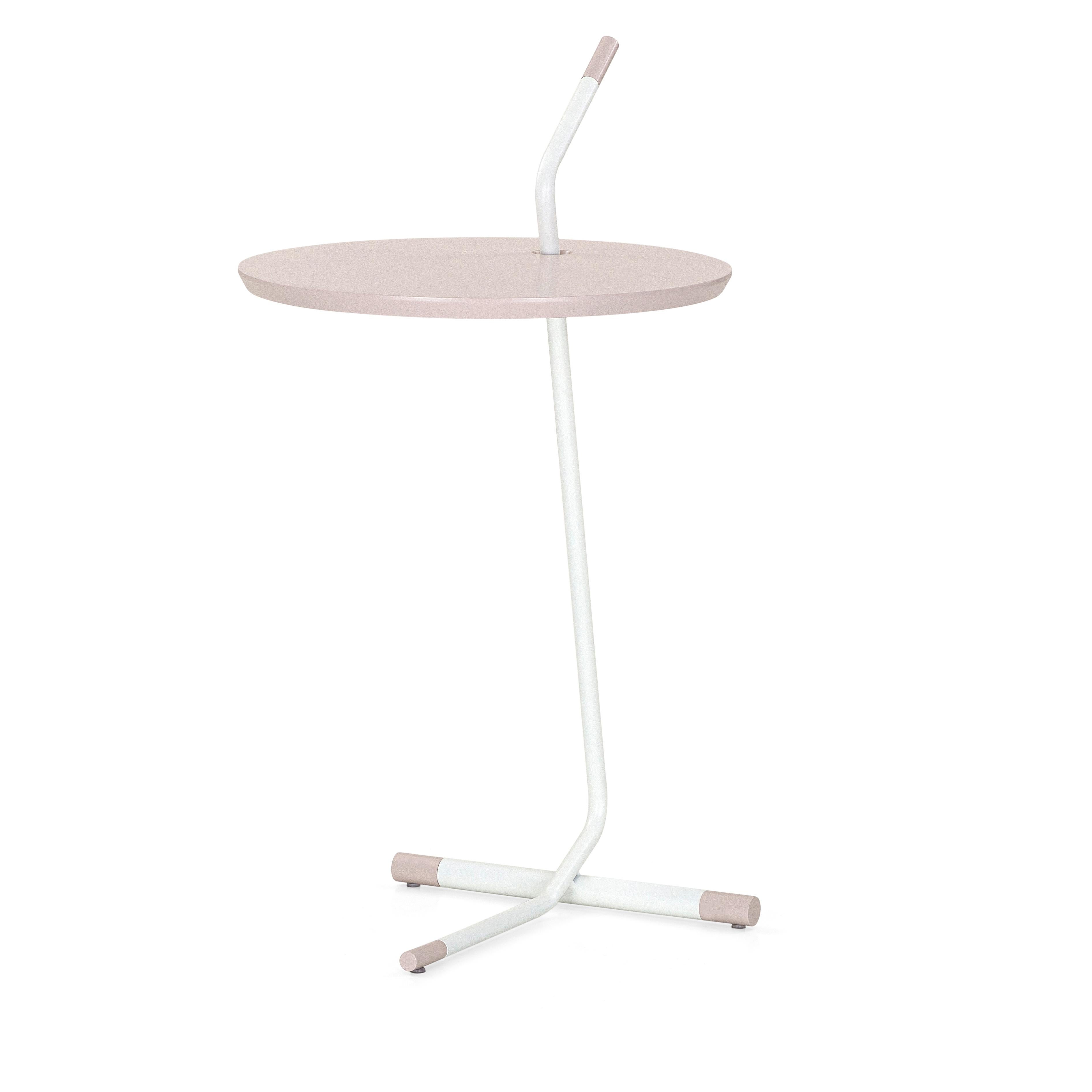The like side table features an MDF wood top in quartz finish and a metal base. This table is made of parallels, giving a distinctive shape and an unconventional look. This table features a light pink wood finish and the metal will attract all the