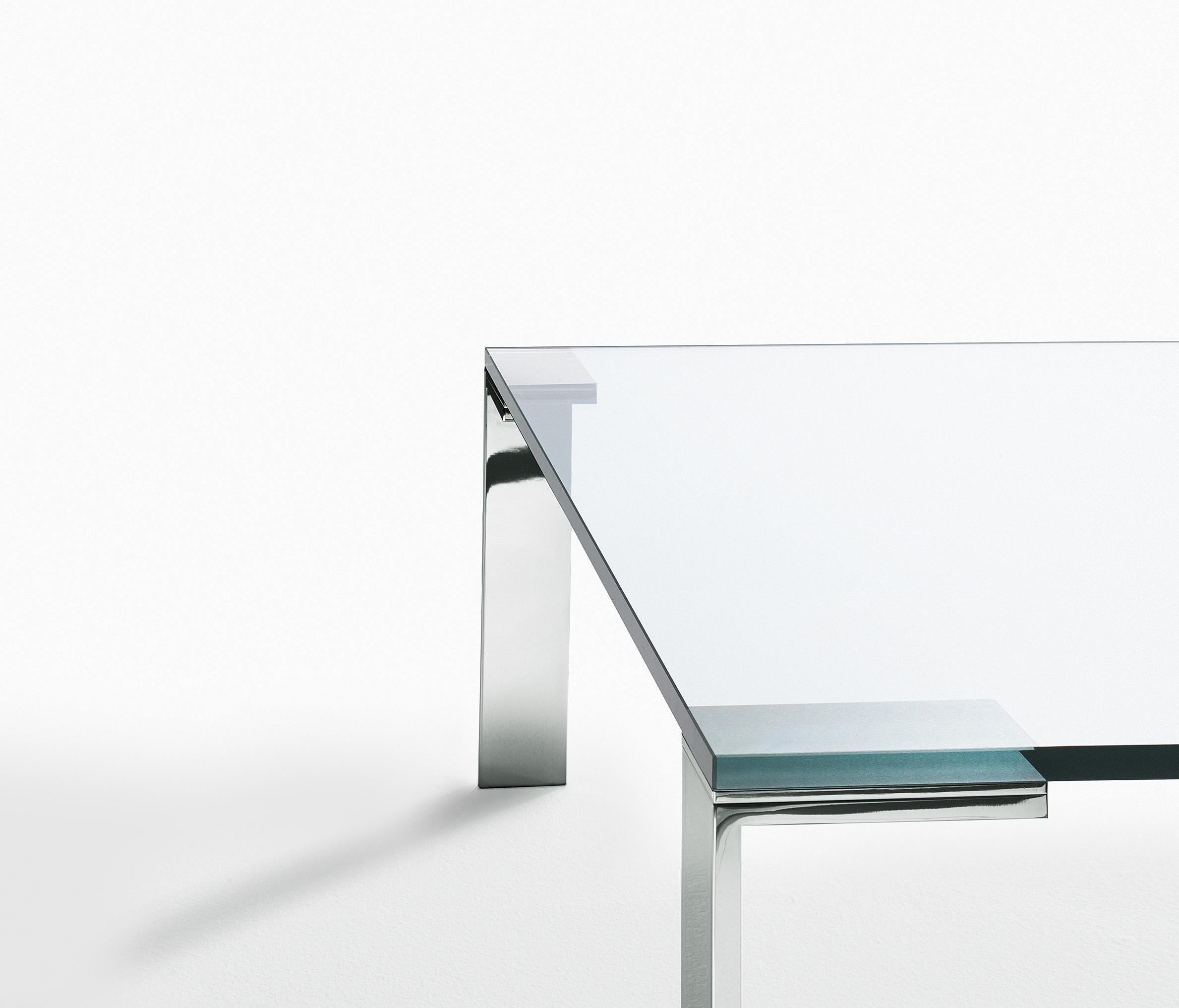 Like glass coffee table with clear top and polished legs. A sleek and modern addition to any living room or shared space. Designed by Arik Levy in 2004.

Dimensions: 60