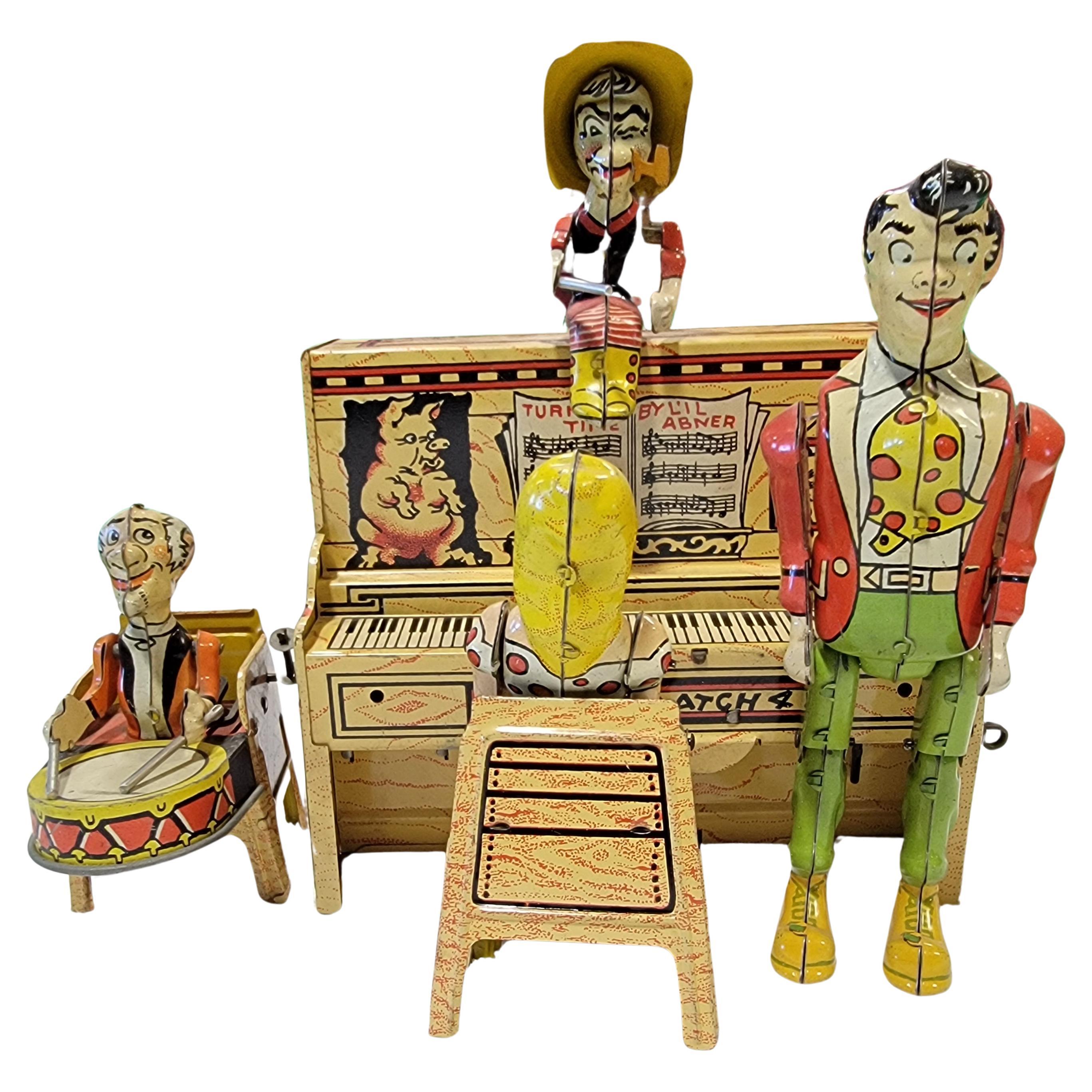 Li'l Abner Tin Lithograph Mechanical Wind-Up Piano Band Toy For Sale