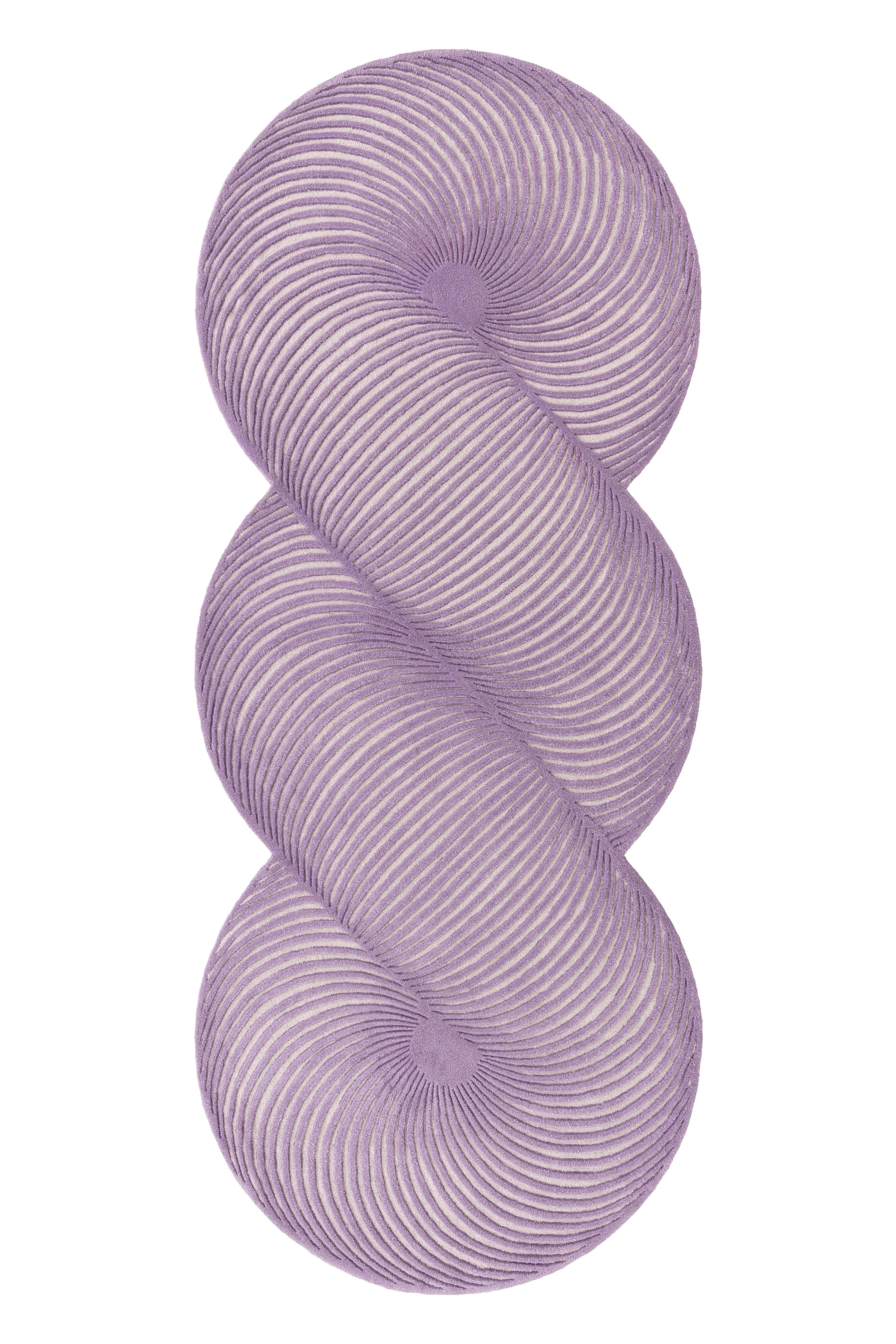 Lilac Giro Rug by Gandia Blasco
Design by MUT Design
Dimensions: W 132 x H 324 cm. 
Materials: 100% wool.
Weight: 18,5 kg

Passion for life outdoors, a dream come true on the edge of a cliff in the north of Ibiza. The elemental and architectural