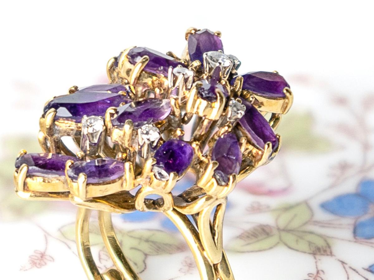 Gilbert Albert Lilac Ring
Yellow gold, Amethyst and Diamonds, circa 1970, maker's mark
 
Swiss jeweler trained in jewelry design at the School of Industrial Arts in Geneva and then at the Beaux Arts in Geneva, Gilbert Albert,  joined Patek Philippe