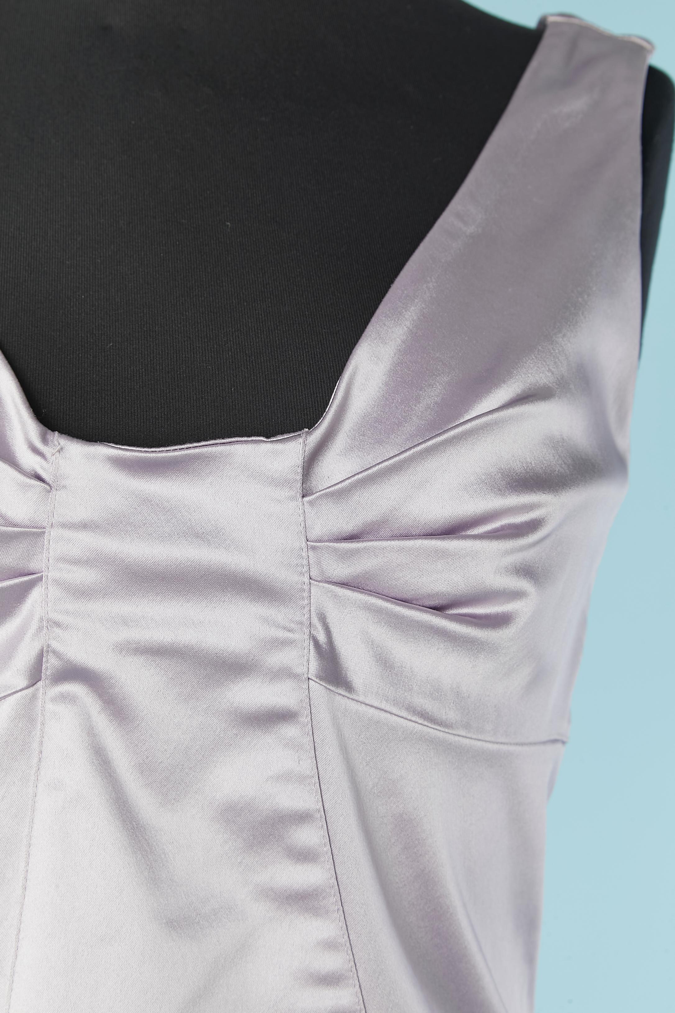 Lilac sleeveless cocktail dress with cut-work. Fabric composition: 51% acetate, 45% polyamide, 4% elastane. 
Zip closure on the middle back. 
Authenticity hologram. Split on the bottom middle back, lenght = 18cm
SIZE on tag 44 (IT) but fit more