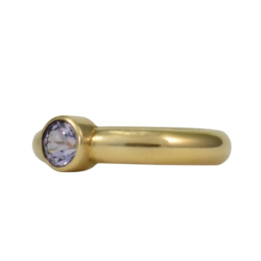 This flirty and feminine spinel solitaire ring, hand fabricated in 18k royal yellow gold by Lynn Kathyrn Miller of Lynn K Designs, is a timeless classic that can be worn on it's own, along with other rings in a stack or as an alternative engagement