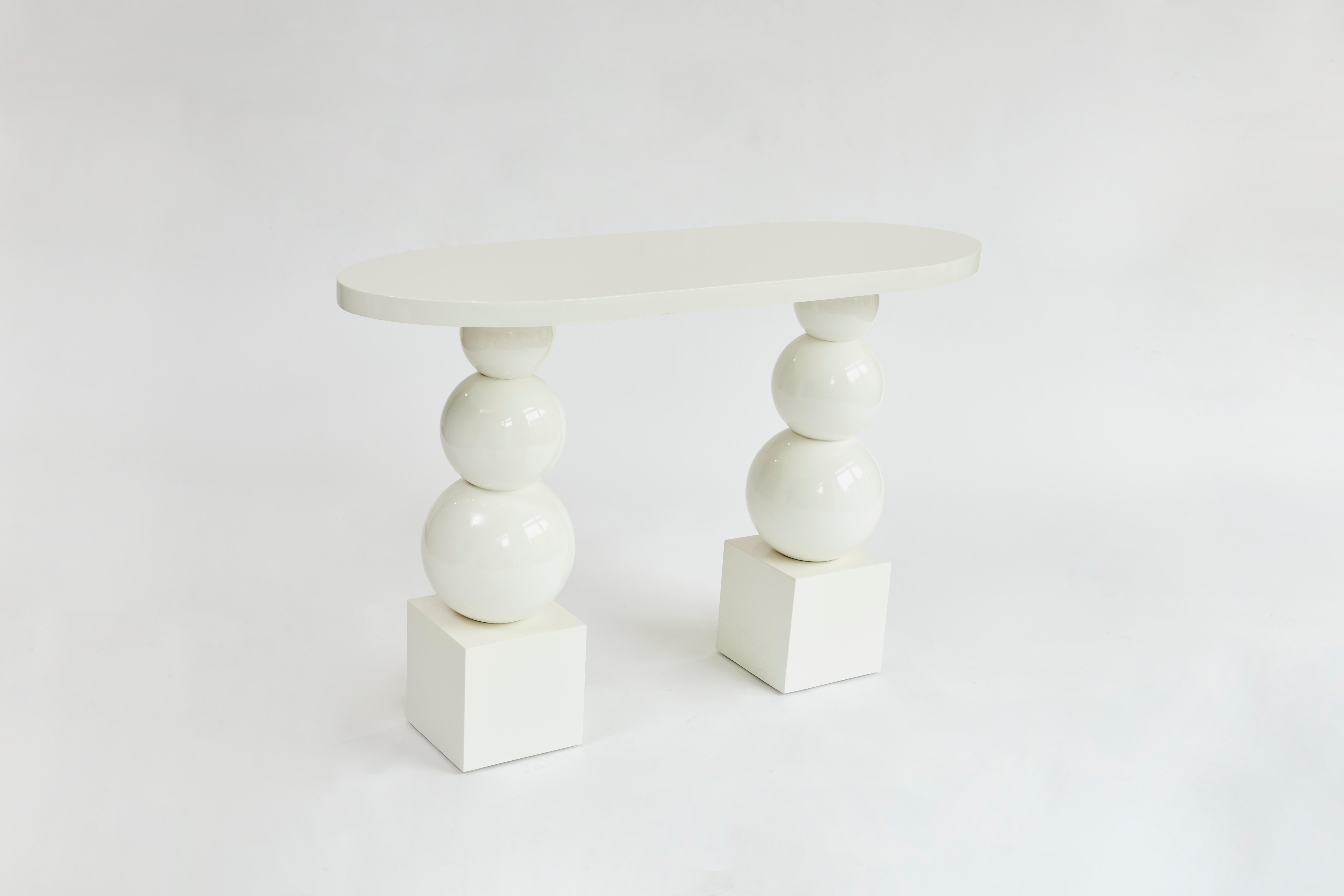 Made to order white lacquer console table designed by Christian Siriano.

Material: White lacquer (available in custom finish)

Dimensions:
Overall Width: 48”
Overall Depth: 16” 
Overall Height: 32”
