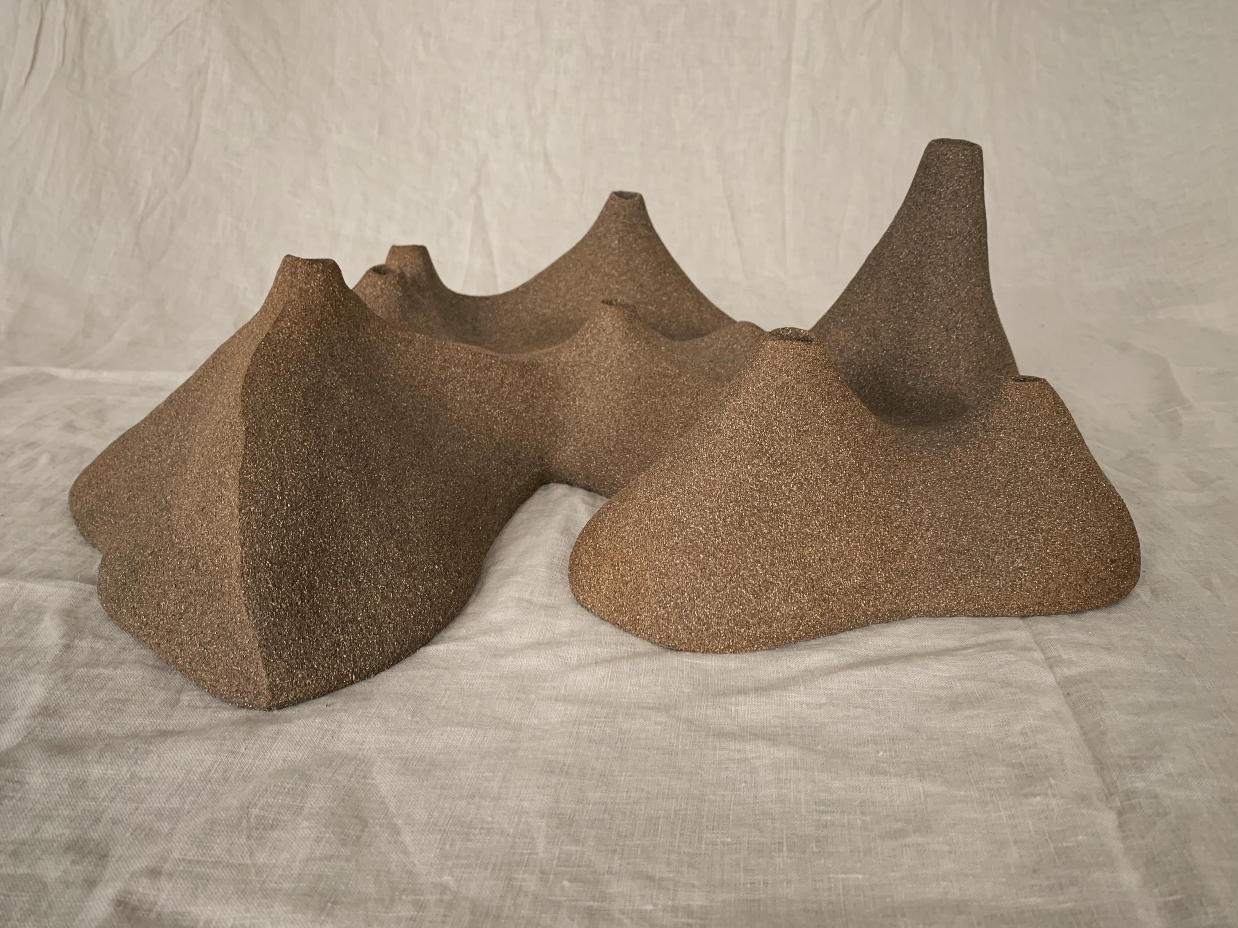 L’île Sculpture by Laura Giudice
Materials: stoneware.
Dimensions: D 52 x W 40 x H 20 cm.

Sandstone colors available: beige, white, or black.  

