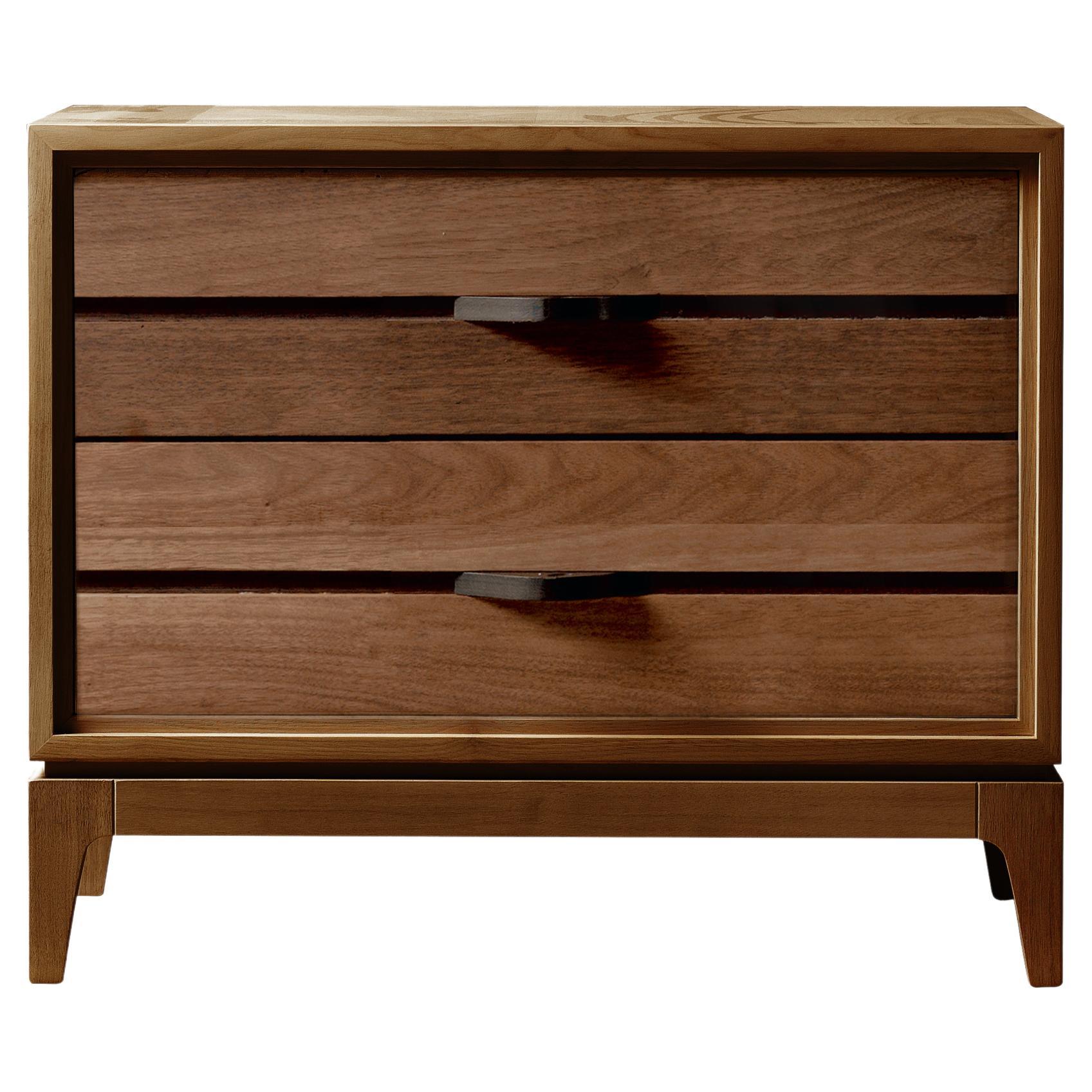 Made in Italy craftmanship shines through the Liliale solid wood bedside tables. With blockboard structure and slightly inclined drawers, they are made by expert hands from high quality solid walnut with acrylic finish. A modern yet classic design