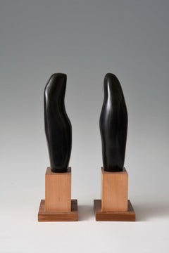 Sinuous Dance, sculpture of two abstracted figures, black marble with wood base