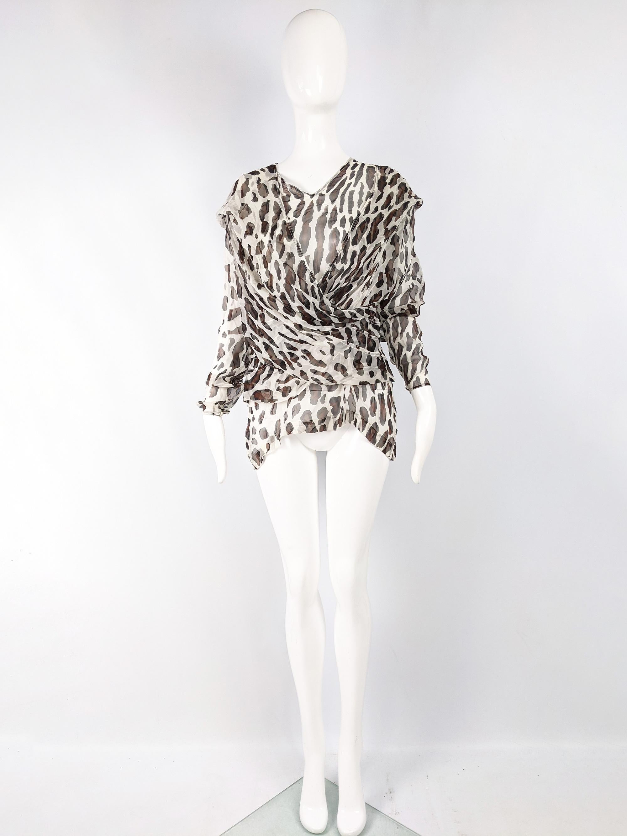 A stunning vintage womens blouse from the 80s by luxury French fashion designer and couturier, Liliane Romi. In  a floaty silk chiffon with a sophisticated animal / leopard print throughout, perfect for a party. The cut is amazing with two draped