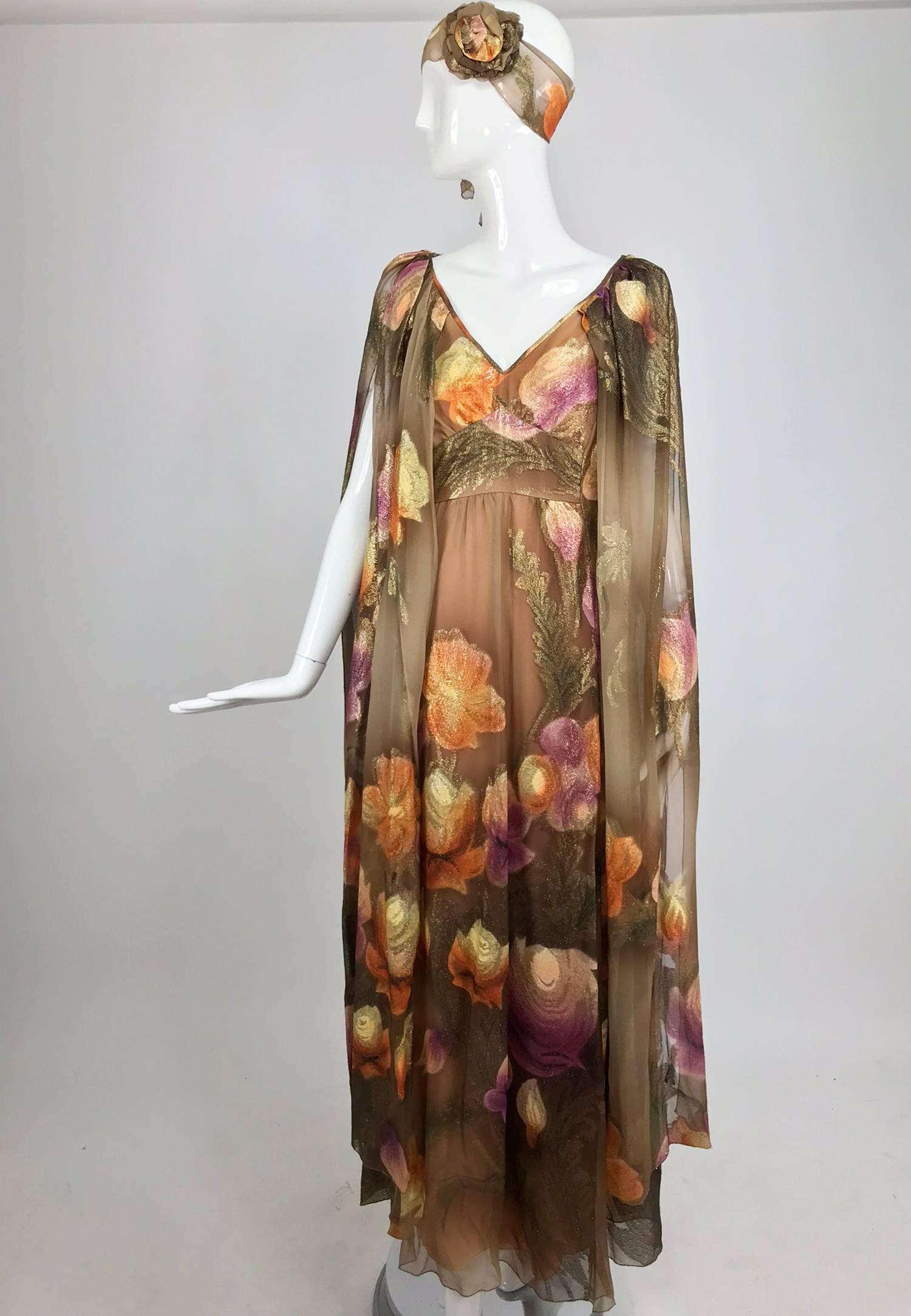 Lilija Nicis hand painted metallic silk chiffon gown from the 1960s. Lilija Nicis made specialty clothing for wealthy clients in the 1950s and 60's at her shop in Rockville Centre New York, she was listed as a couturier and the quality of her