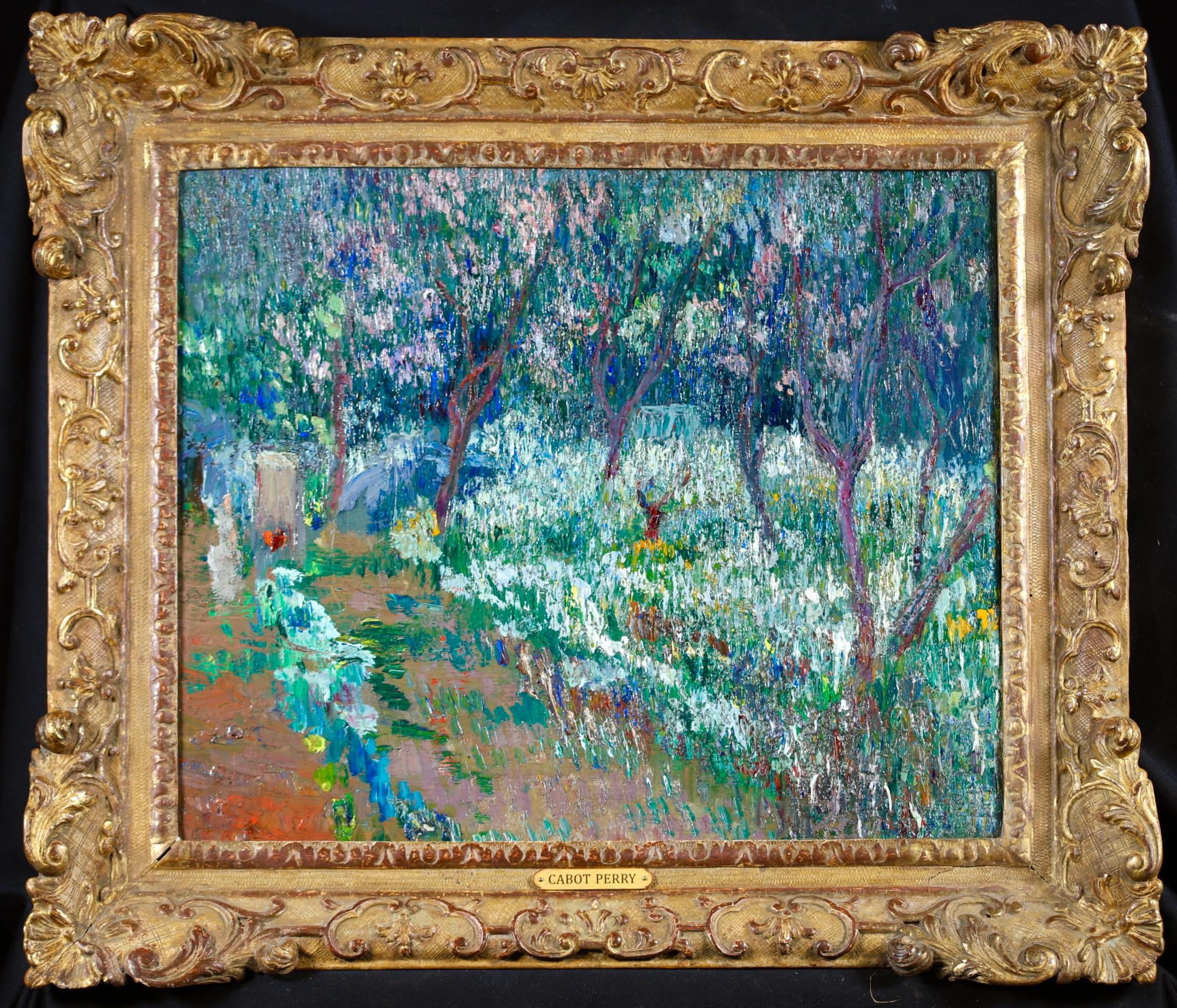 A stunning divisionist style landscape oil on canvas by American impressionist painter Lilla Cabot Perry. The work depicts a beautiful garden in Giverny in bloom. The trees are covered in pink blossom and white, blue and yellow flowers blanket the