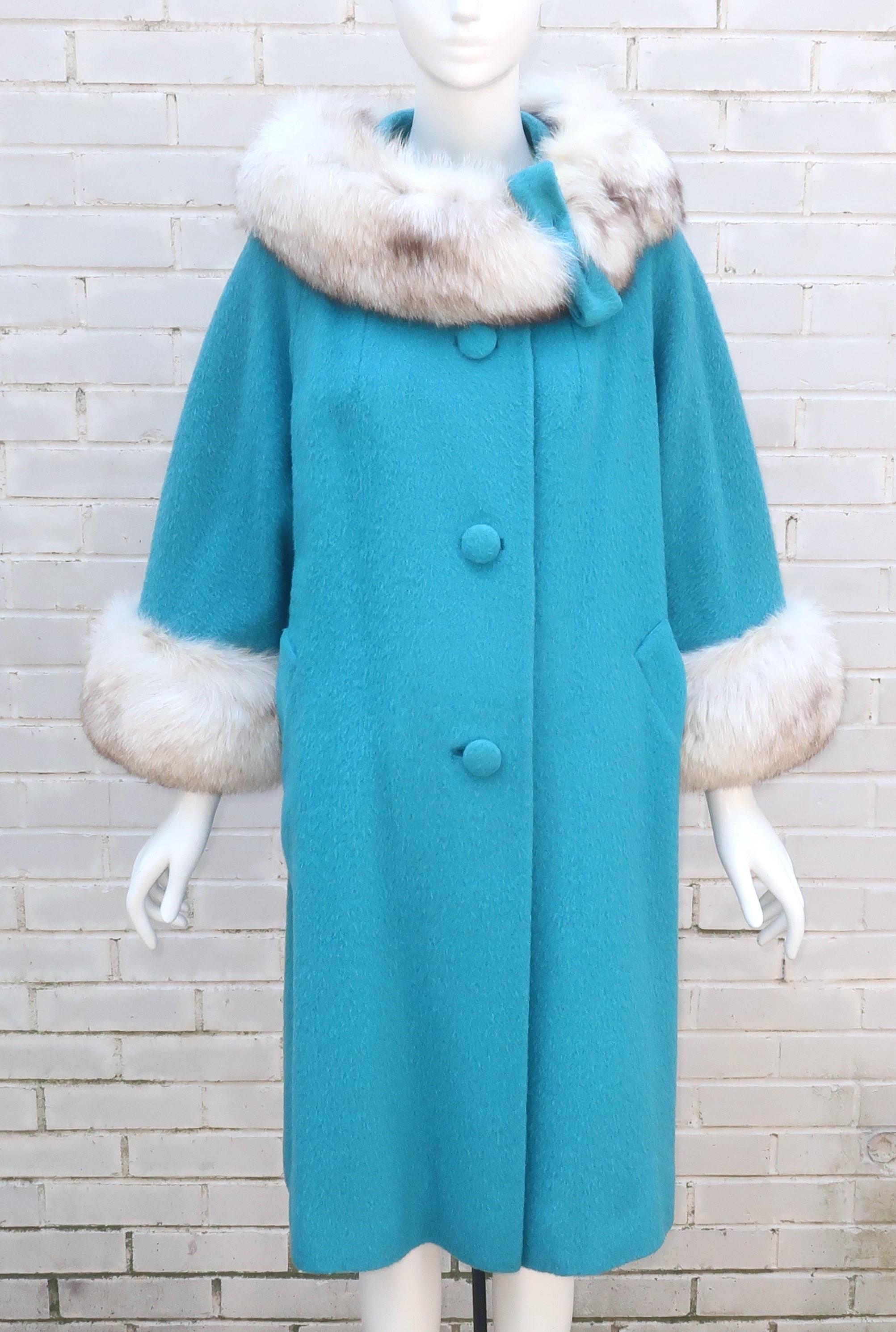 Glamour alert!  Designed under the artistic direction of Adolph Schuman for his company Lilli Ann, a fabulous aqua blue French wool coat with lush fox fur trim at the collar and cuffs.  This has a classic 1960's silhouette with relaxed shoulders, an
