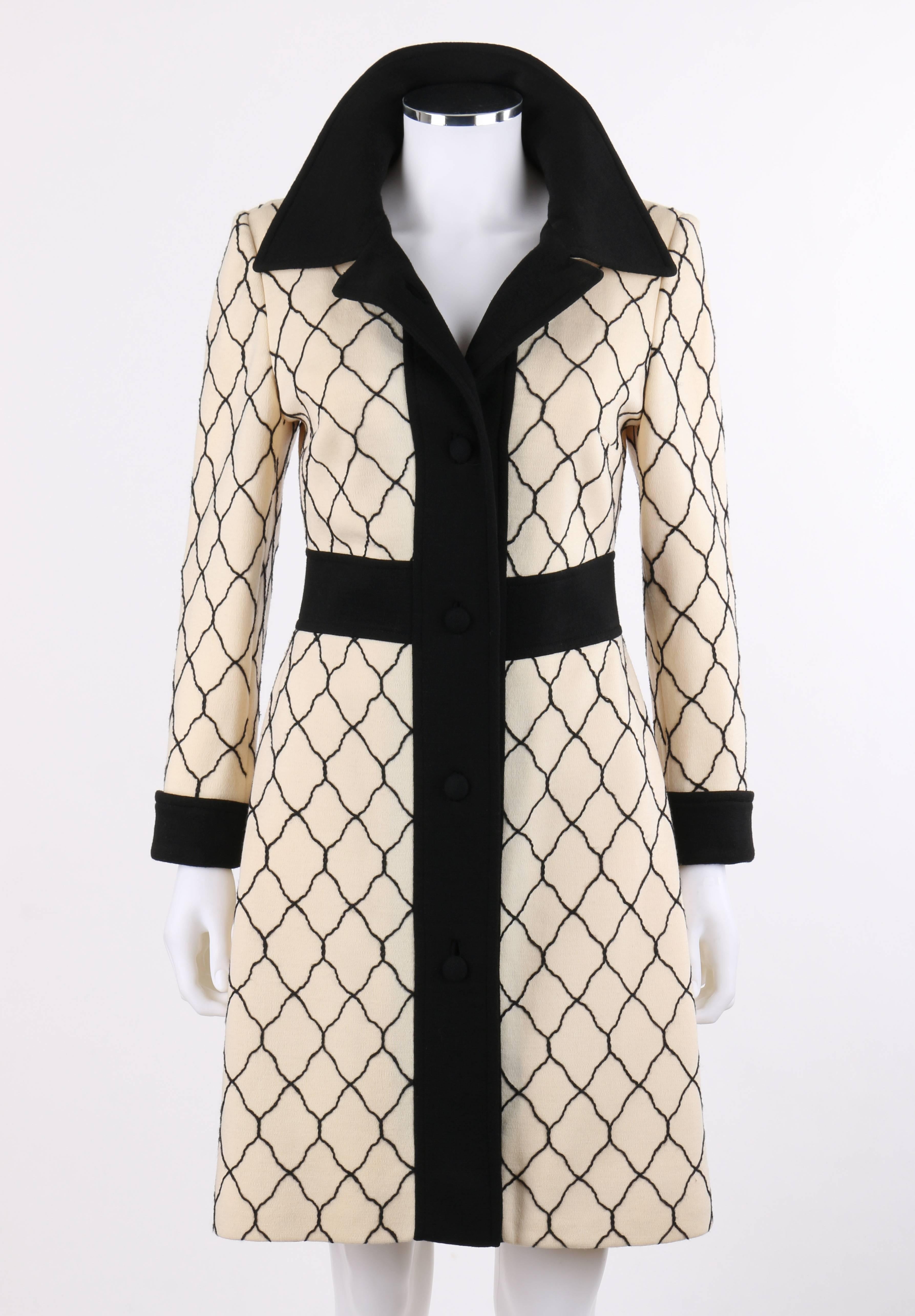 Vintage Lilli Ann Knit c.1960's cream and black quartrefoil lattice pattern wool car coat. Cream wool knit with black twisted cord quatrefoil lattice pattern. Contrasting black bal collar. Five center front covered buttons with single button and