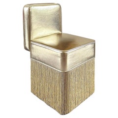 Fauteuil Lilli Gleaming en cuir métallique doré avec franges en lurex