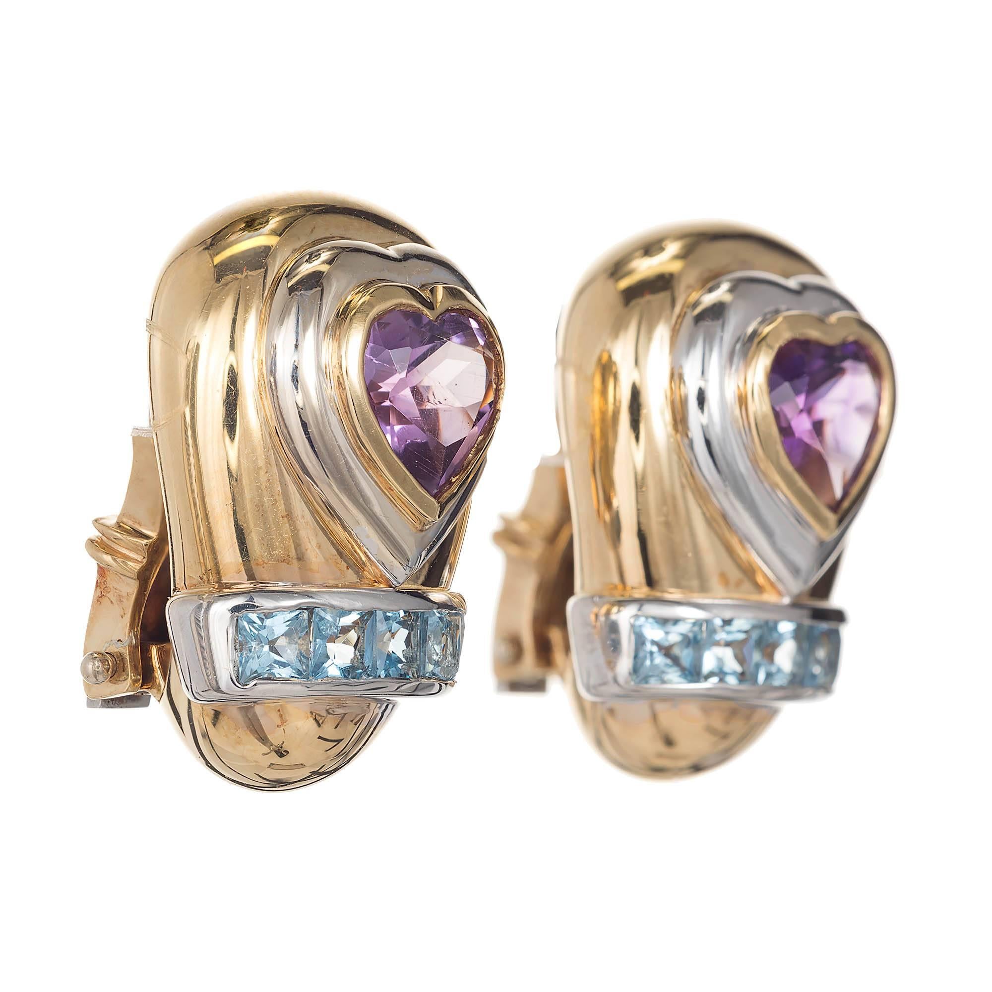 18k gold yellow and white gold Amethyst and Aqua, earrings by the designer Lilli. Extremely well made with heavy secure clips post. Natural untreated square cut Aquamarines in a white gold channel and stunning deep vibrant purple Amethyst on the