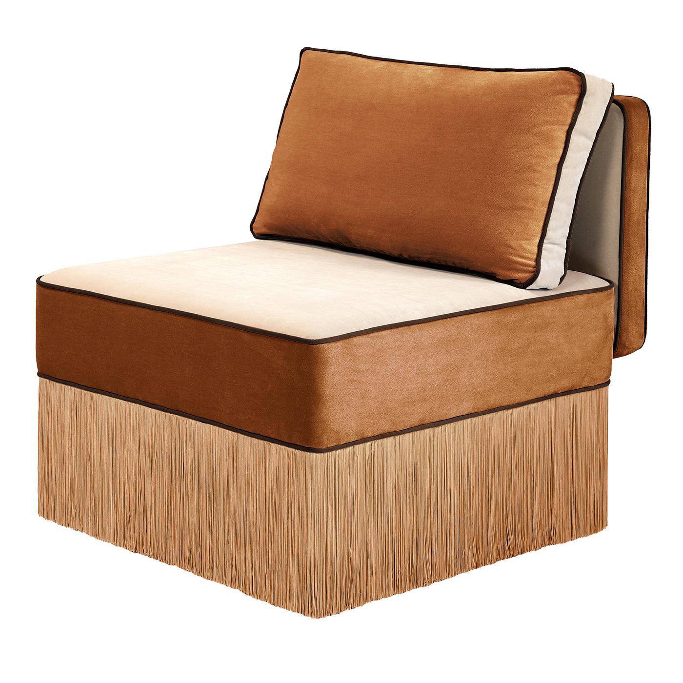 This bicolor lounge chair is part of the Lilli Chair family and the Asymmetrical Armchair series, featuring clean lines, generous proportions, and refined artisanal craftsmanship. Upholstered in cognac and beige fabric, it presents a warm, inviting