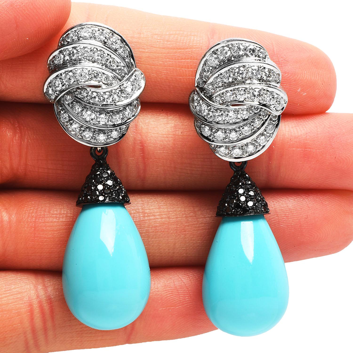 Exquisite vintage retro earrings day and Night from circa the 1990s.

with a crossover design on the top and a colorful dangle drop design. 

they are crafted in luxurious 18K white gold.

Topped with a sparkly (80)