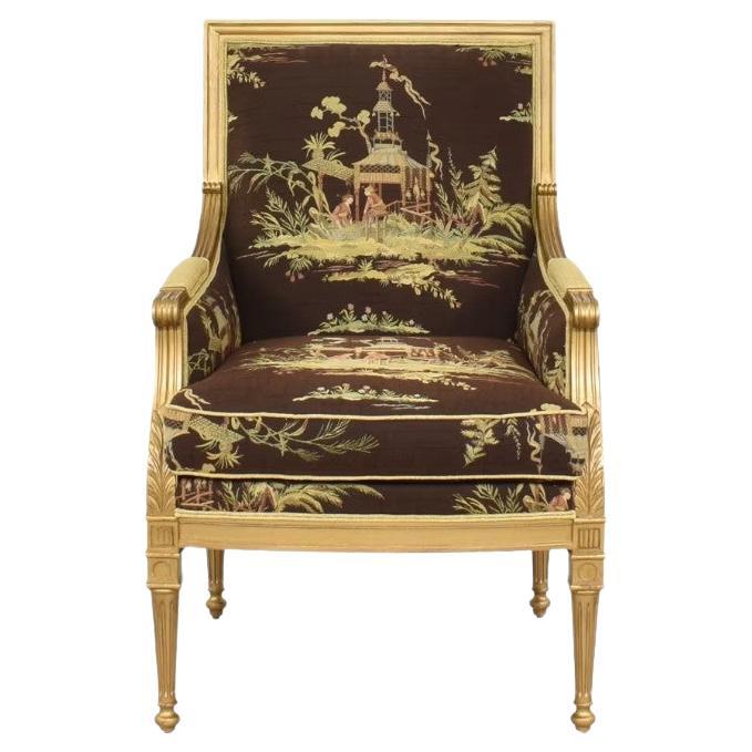Classic Louis XVI style bergère lounge chairs by Lillian August for Hickory White Furniture.  These Exteter tight back accent club chairs feature beautifully carved wood frames in a painted gilt finish.  The chair fronts are upholstered in a rich