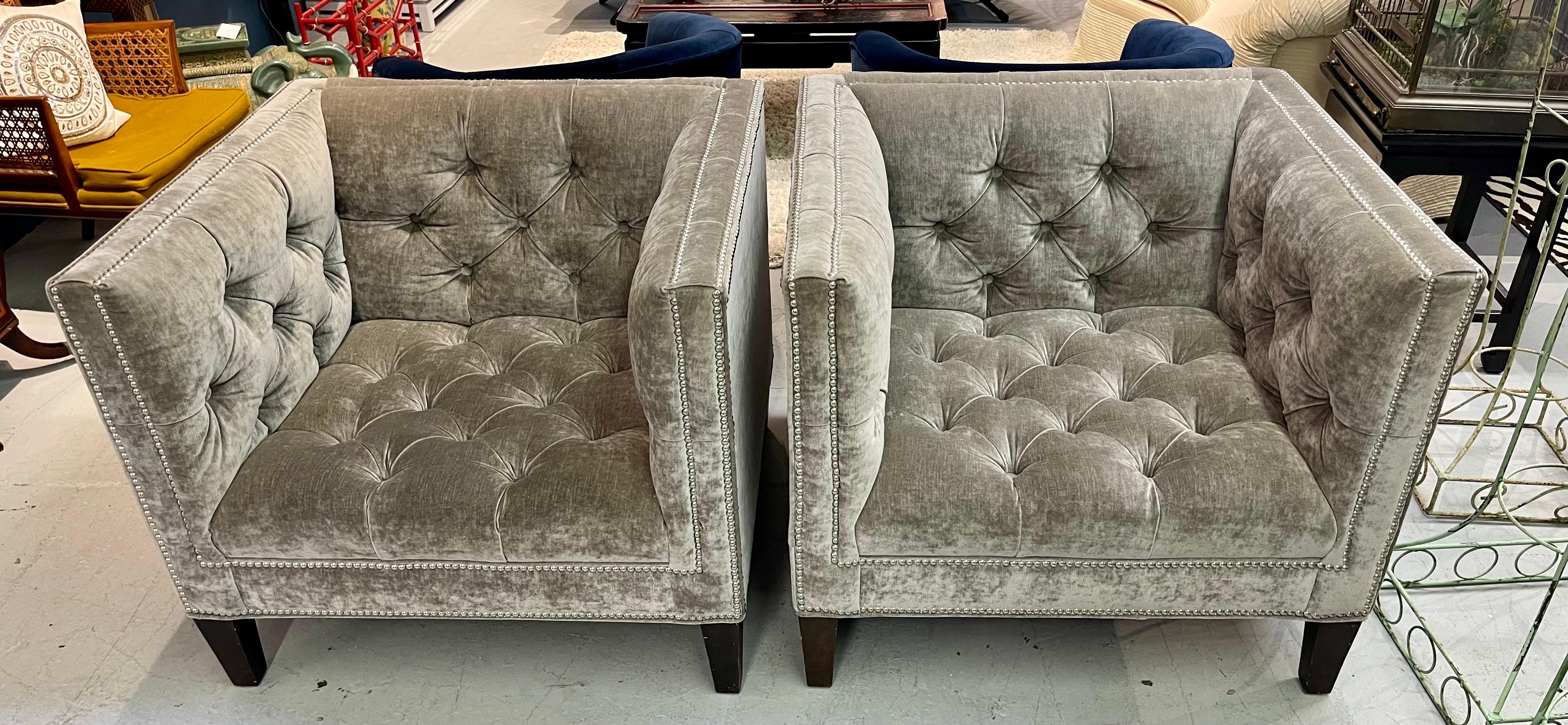 Elegant pair of matching square back transitional chairs with full chesterfield style tufting as shown in attached pictures.  The velvet/mohair fabric is gray and the chairs are adorned with silver naiheads as shown.  Very sleek, yet transitional.