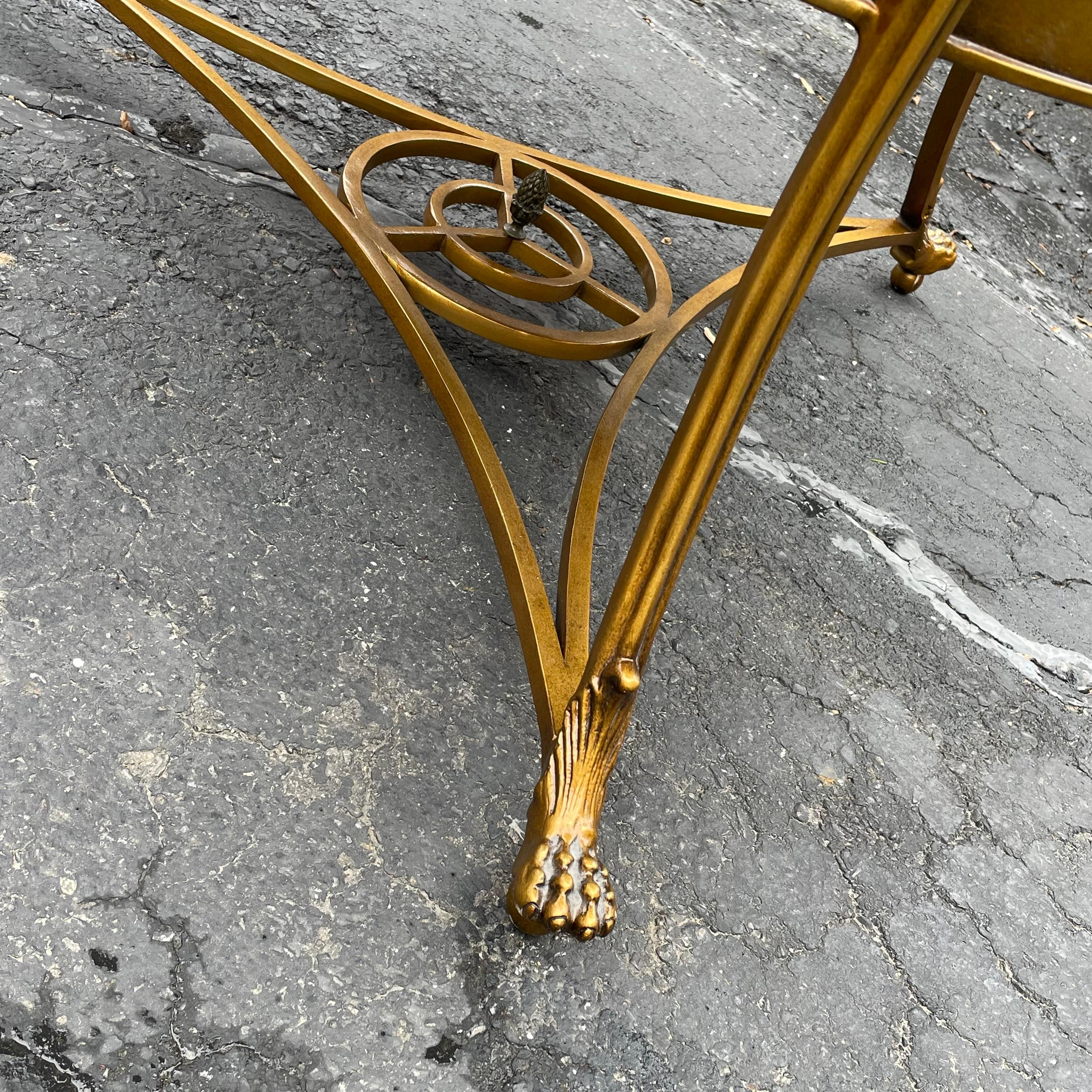 Fantastic Lillian August Weston center table with aged gold finish and eglomise mirrored top and shelf.