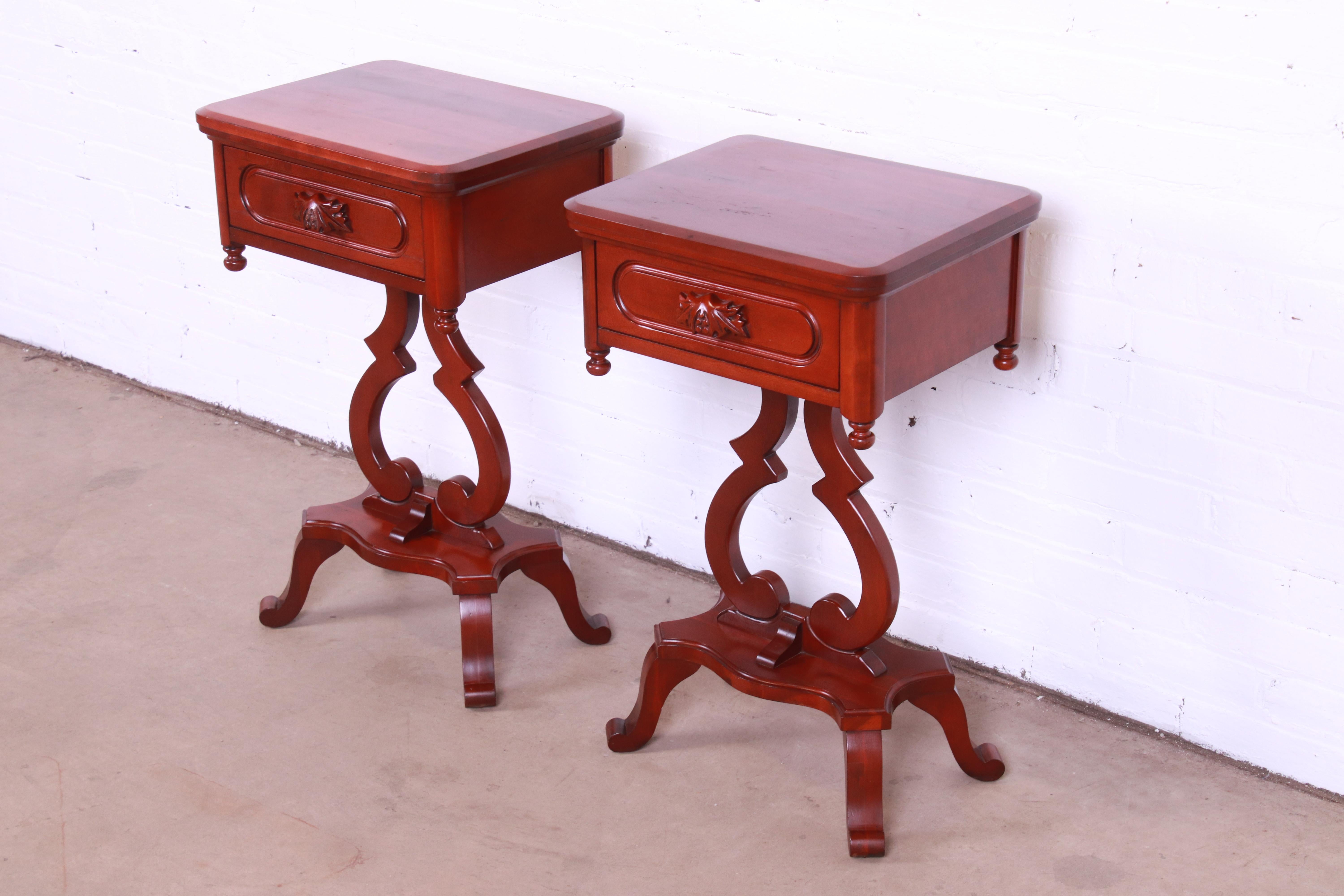 A gorgeous pair of Victorian style carved solid cherry wood nightstands

By Davis Cabinet Company, 