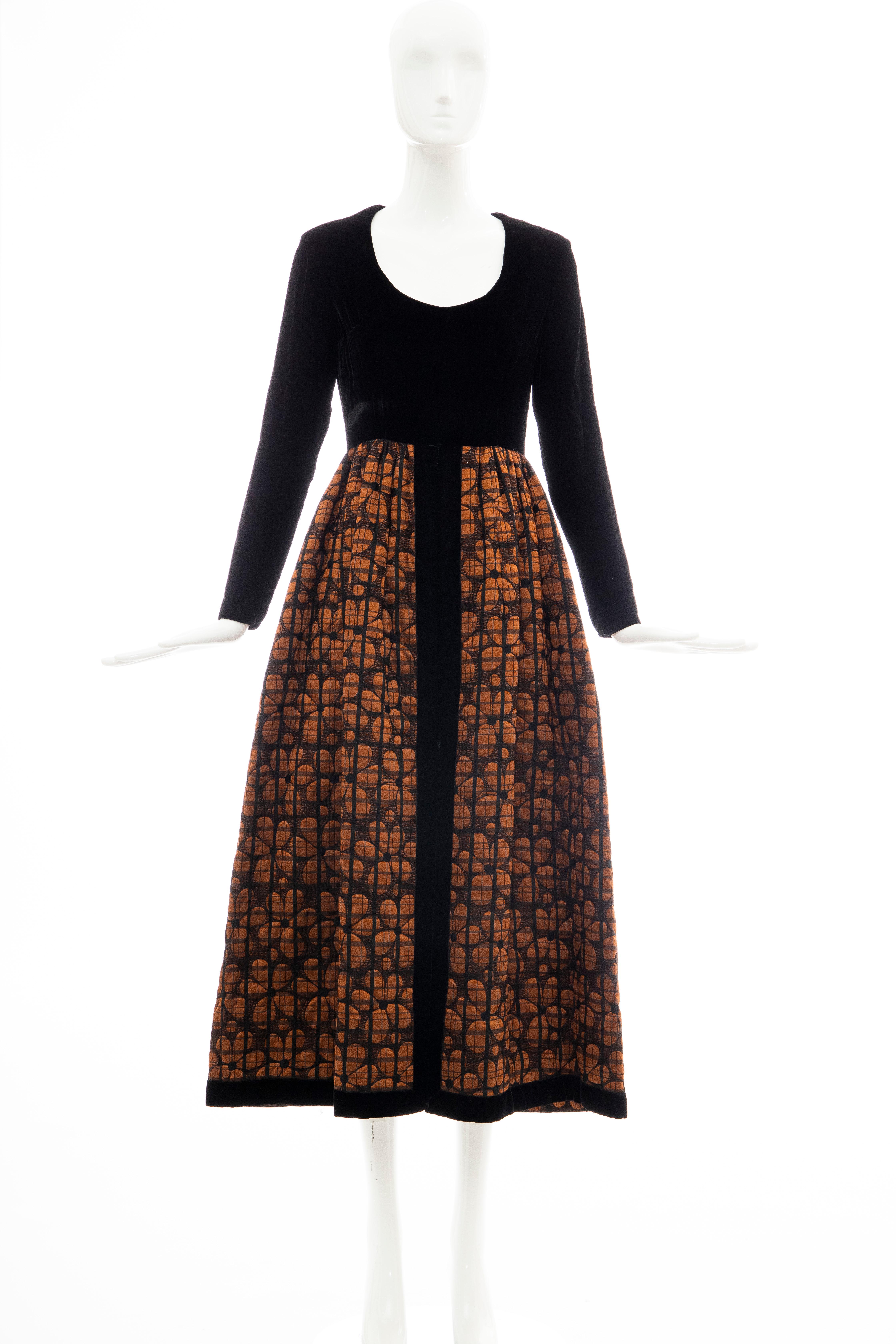 Lillie Rubin, Circa: 1970's black silk velvet with U neckline and copper floral quilted skirt trimmed in black silk velvet, two front pockets, back zip with hook and eye closure evening dress.

Size: 8, Modern: Size 6

Bust: 34, Waist: 25, Hips: 58,