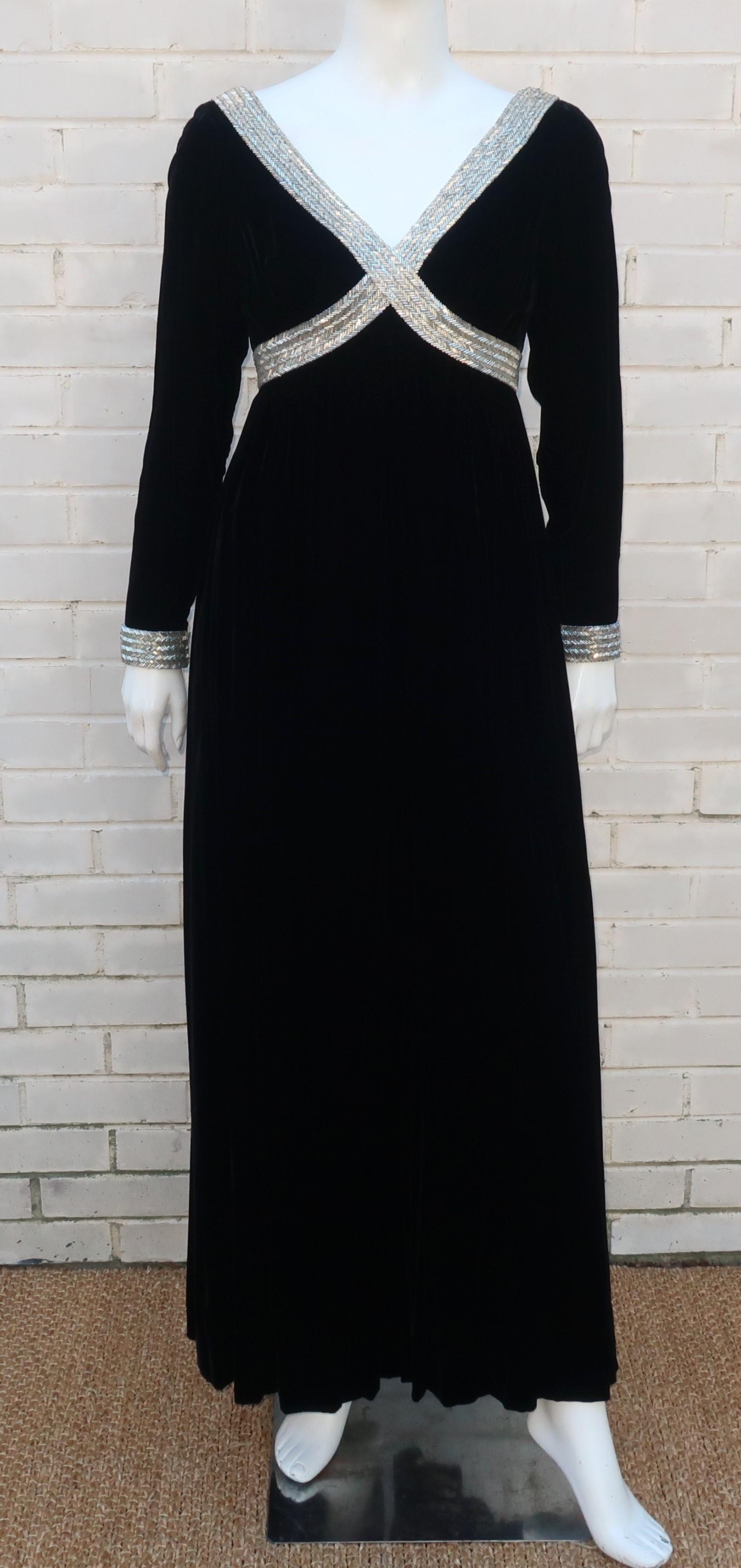 1960's ultra glam black velvet jumpsuit with intricate silver beading at the bodice and cuffs.  The jumpsuit zips and hooks at the deep v-back with a voluminous pant leg that is easily mistaken as a full skirt and hidden side pockets.  The