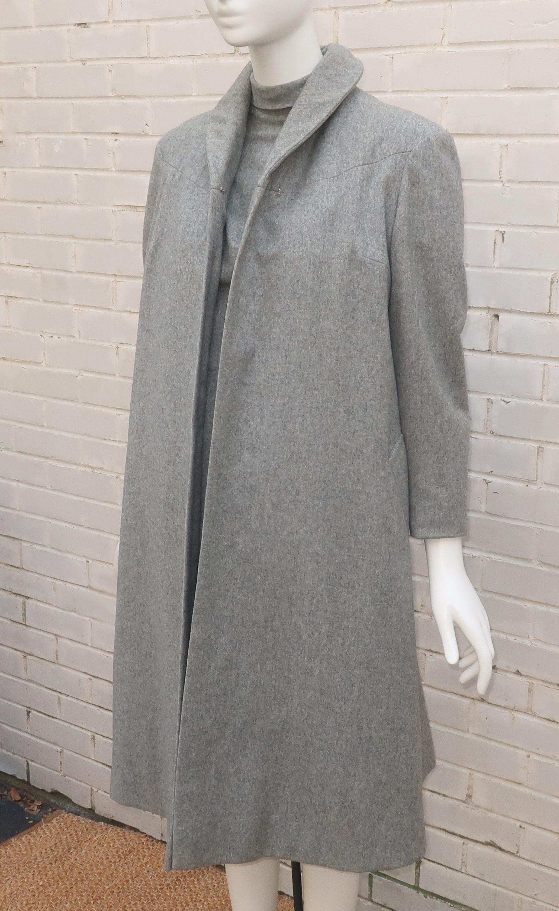 Early 1950's Lillie Rubin dress & coat ensemble in a dove gray flat wool.  The dress has a classic '50's 'wiggle' silhouette with a rolled mock turtle neck collar and a bustle style panel in the back accented by a black grosgrain ribbon bow.  It