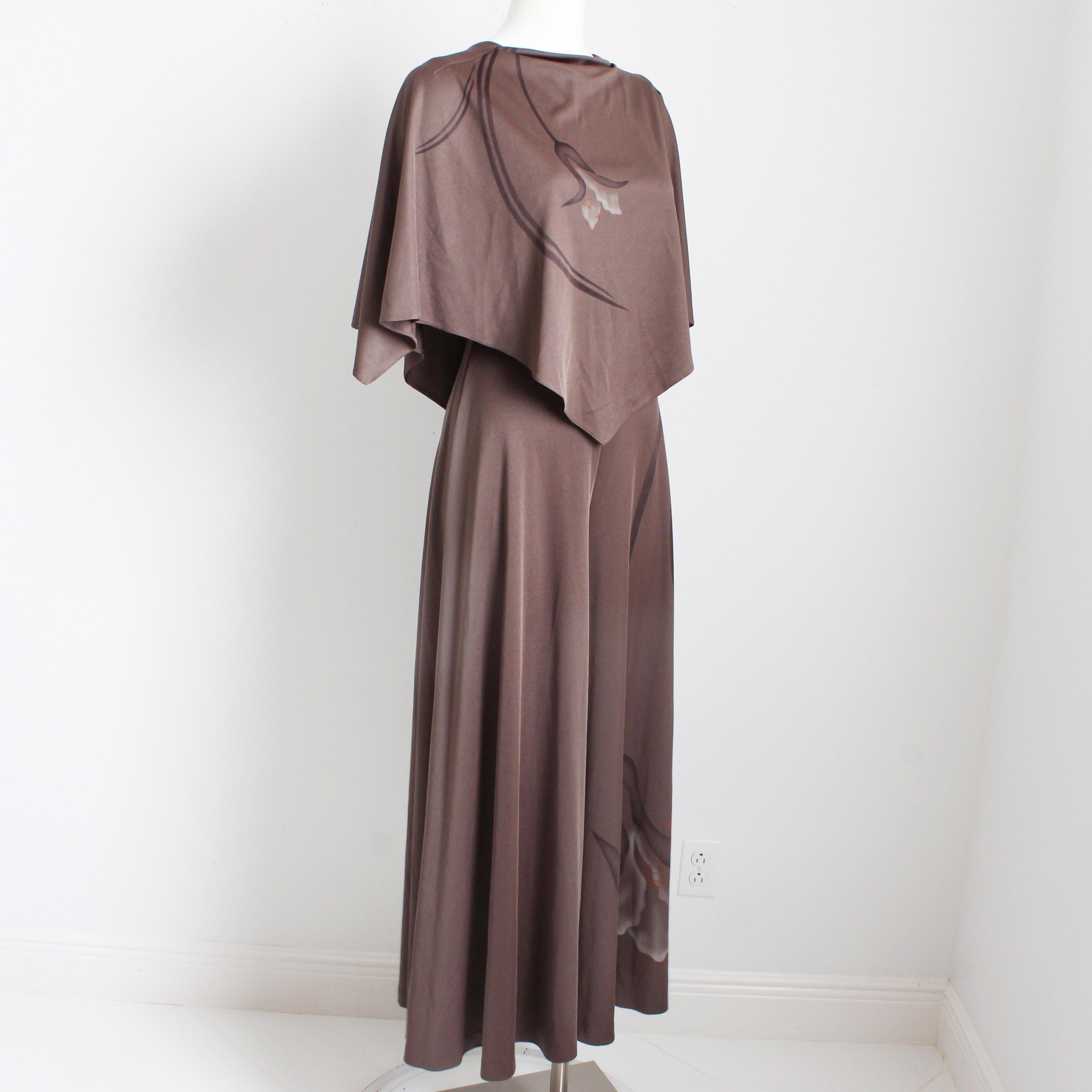 Preowned, vintage Lillie Ruben jumpsuit, likely made in the mid 1970s. Made from taupe-hued brown jersey fabric with a simple floral print, it features an attached caplet at the bodice, a V-back, and wide leg, palazzo style pants!

Incredibly rare!