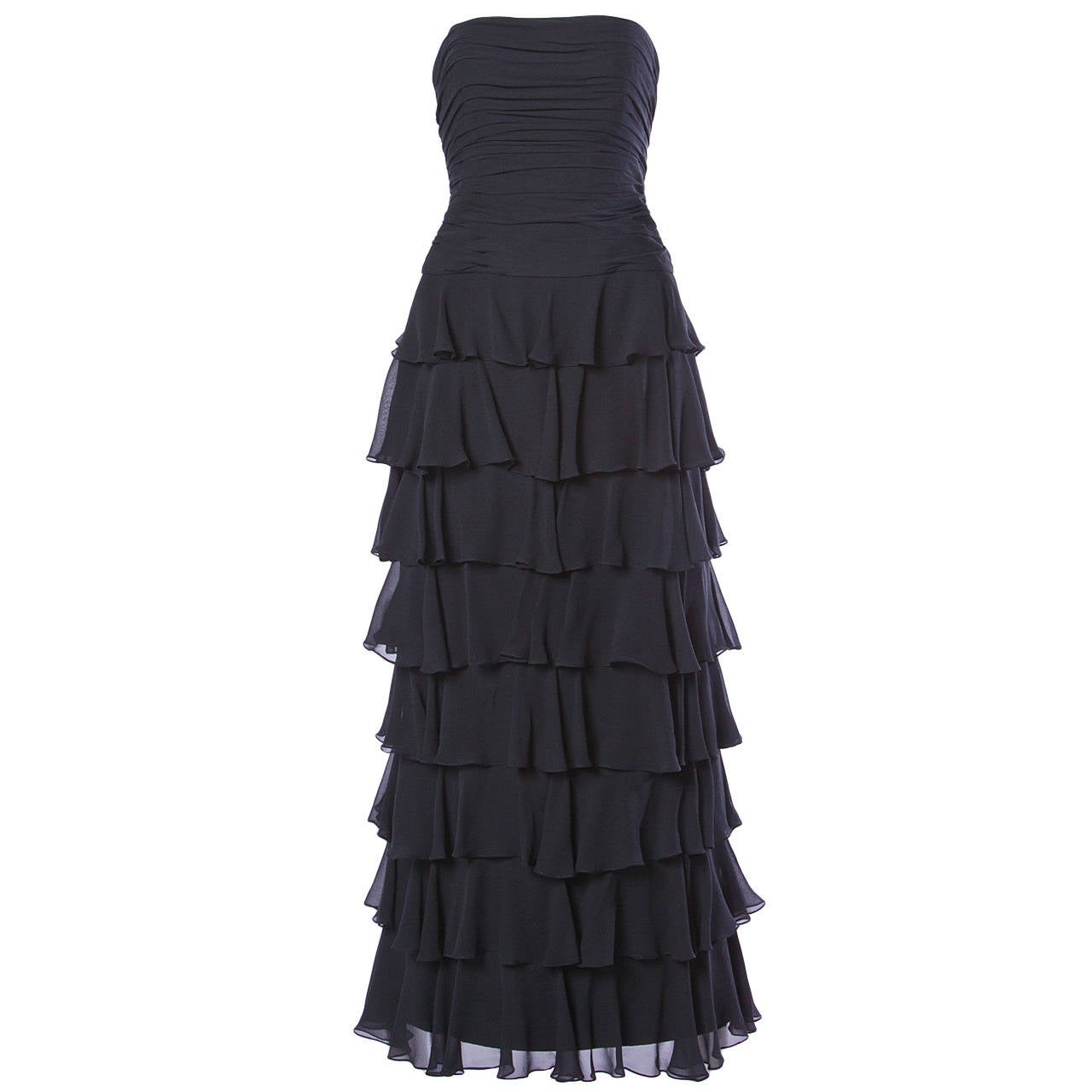 This strapless tiered silk gown by Lillie Rubin comes with a matching wrap. Ruched structured bodice. Rear zip closure.

Details:
Fully Lined
Back Zip and Hook Closure
Marked Size: 4
Color: Black
Fabric: Silk

Dress Measurements:

Bust: 32
