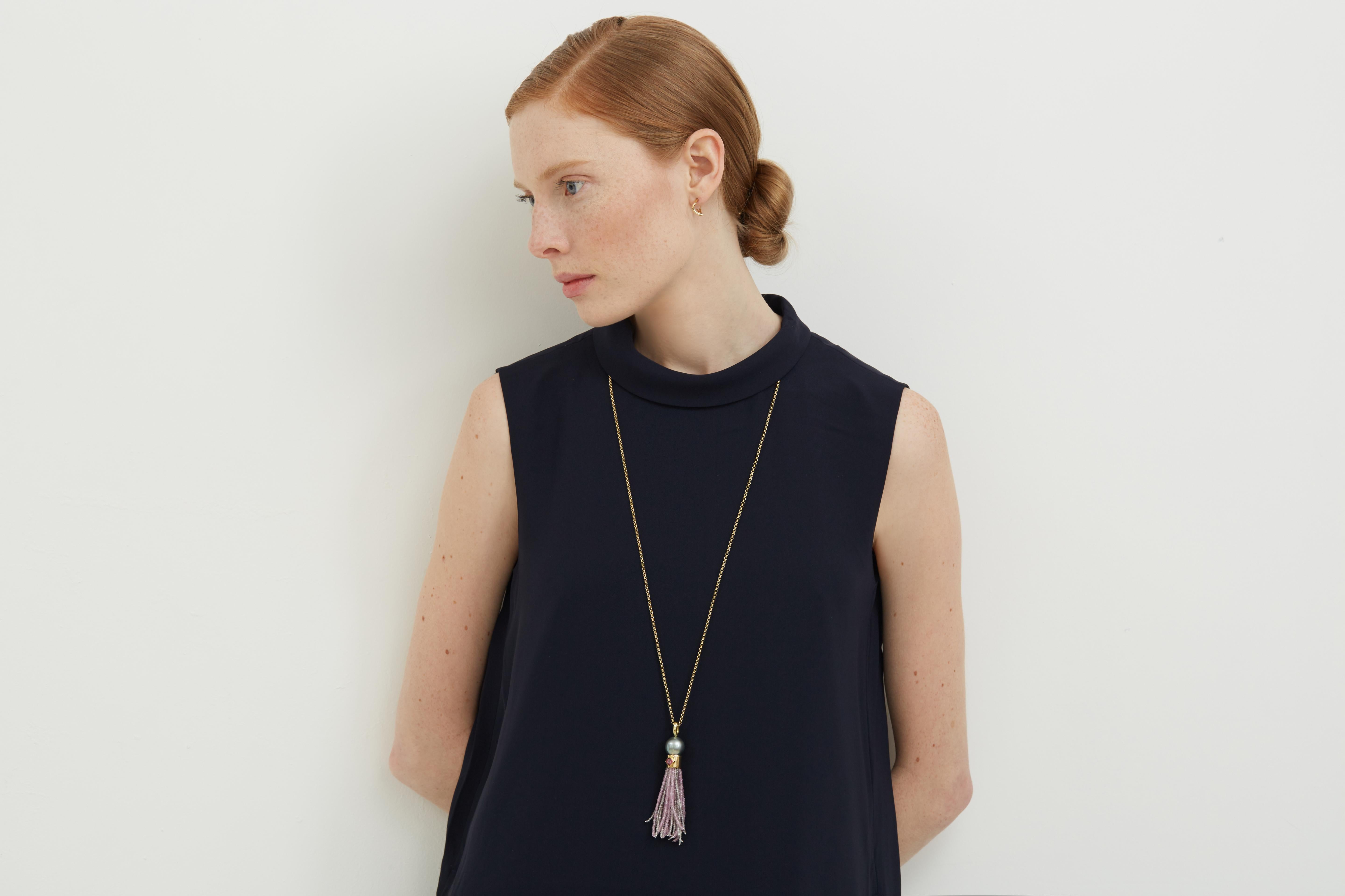 1920's inspired Tassel Necklace in 18 carat gold with a Tahitian Pearl, Diamonds and Green Sapphire beads. A statement piece that can be worn casually and formally and suitable for all ages. Joining the Sapphire beads are thin gold threads which add