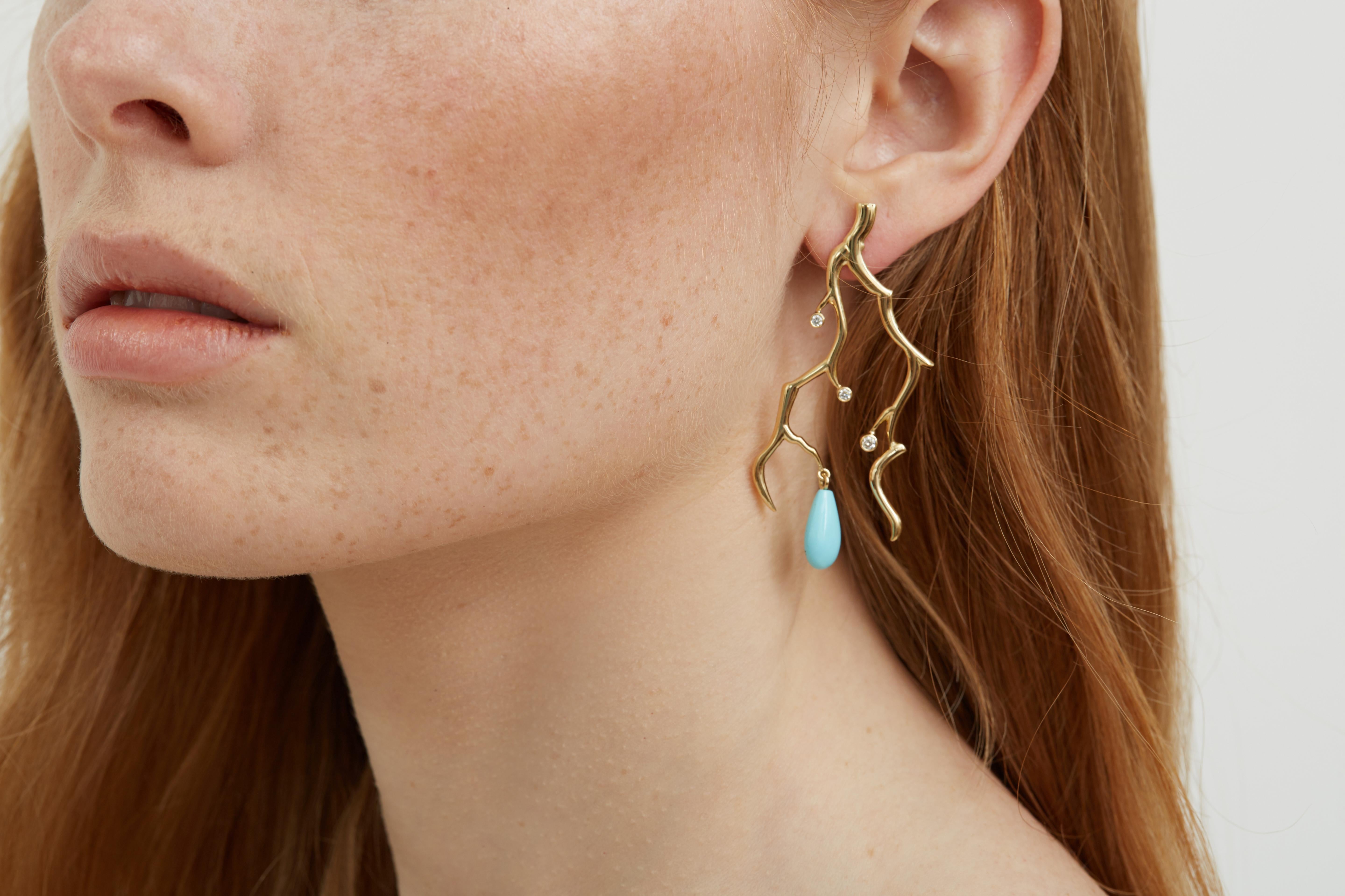 A pair of striking summer soiree cocktail earrings in 18 Karat yellow gold. Inspired on coral branches they are sprinkled with diamonds and the gemstone is a pair of beautiful pair of turquoise drops.  The turquoise is Sleeping Beauty from Arizona