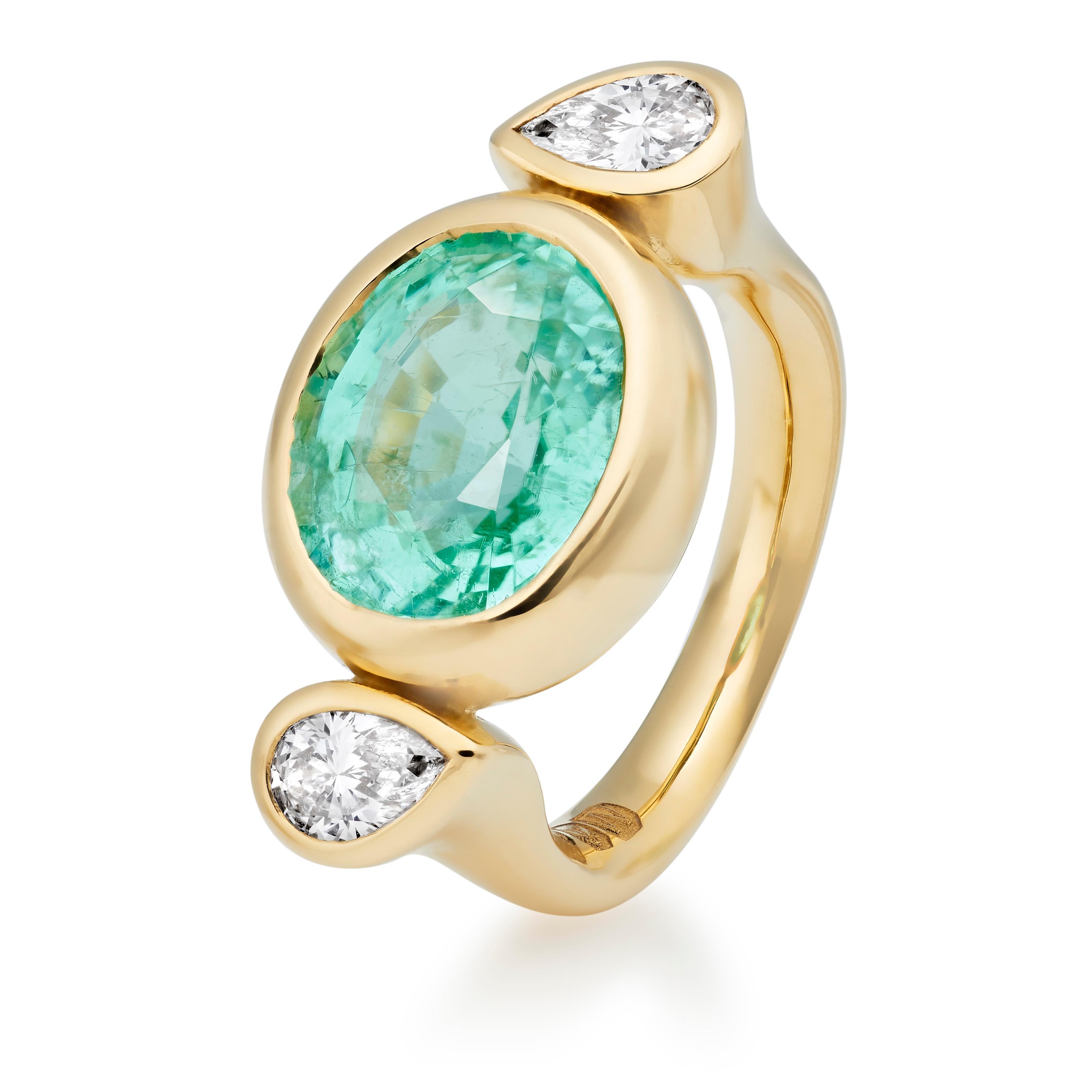 The Bon Bon is one of Lilly Hastedt's signature rings. This particular ring has the sought after Paraiba Tourmaline in an oval faceted cut paired with sparkling pear shaped diamonds. 

The design on this ring follows the roundness of the gemstones.