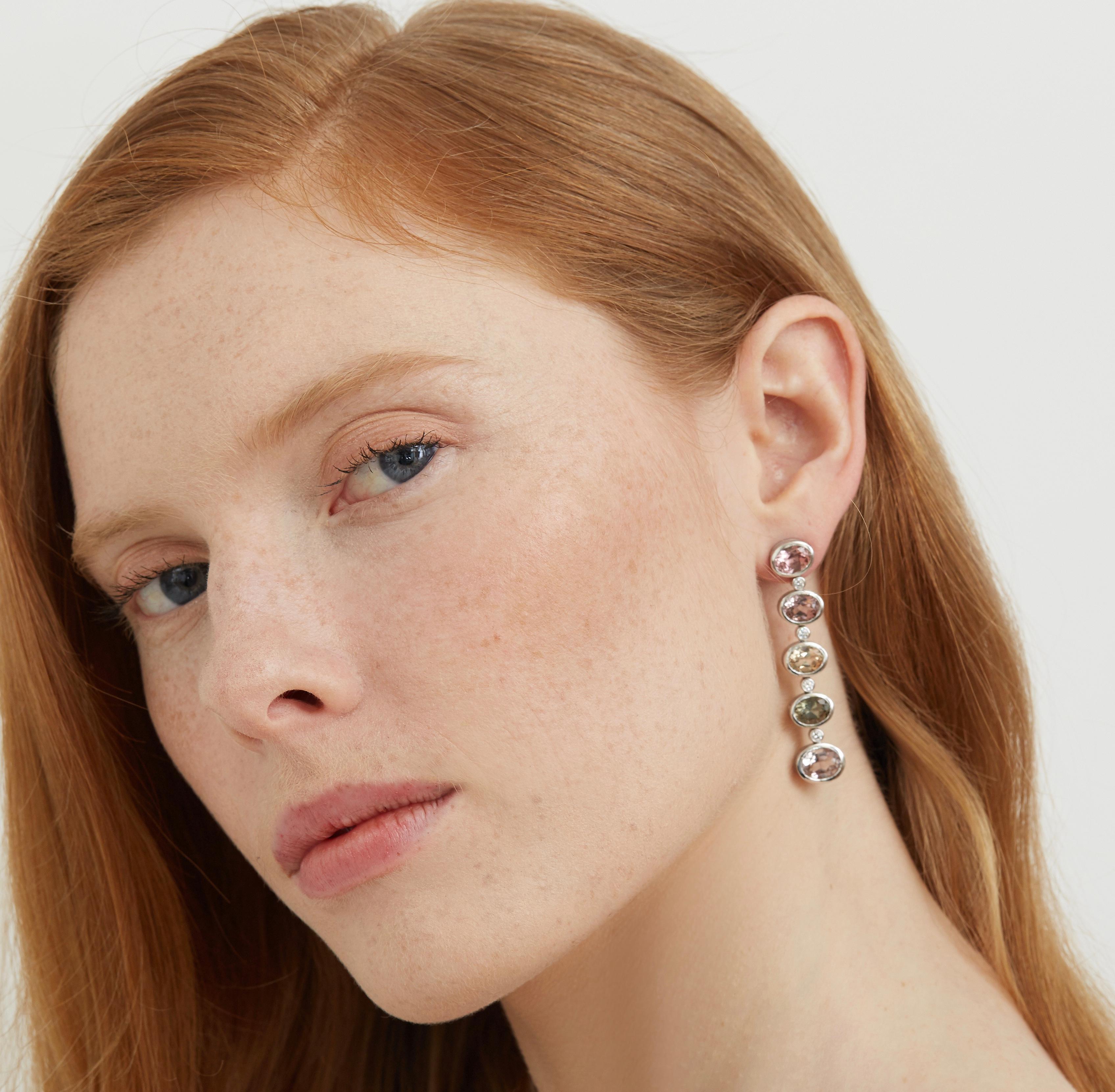 Make a grand statement in these Lilly Hastedt chandelier earrings which feature different pastel coloured tourmalines enveloped in 18 karat gold.  The subtle tones sparkle and blend well with all skin tones and will complete any outfit for a special