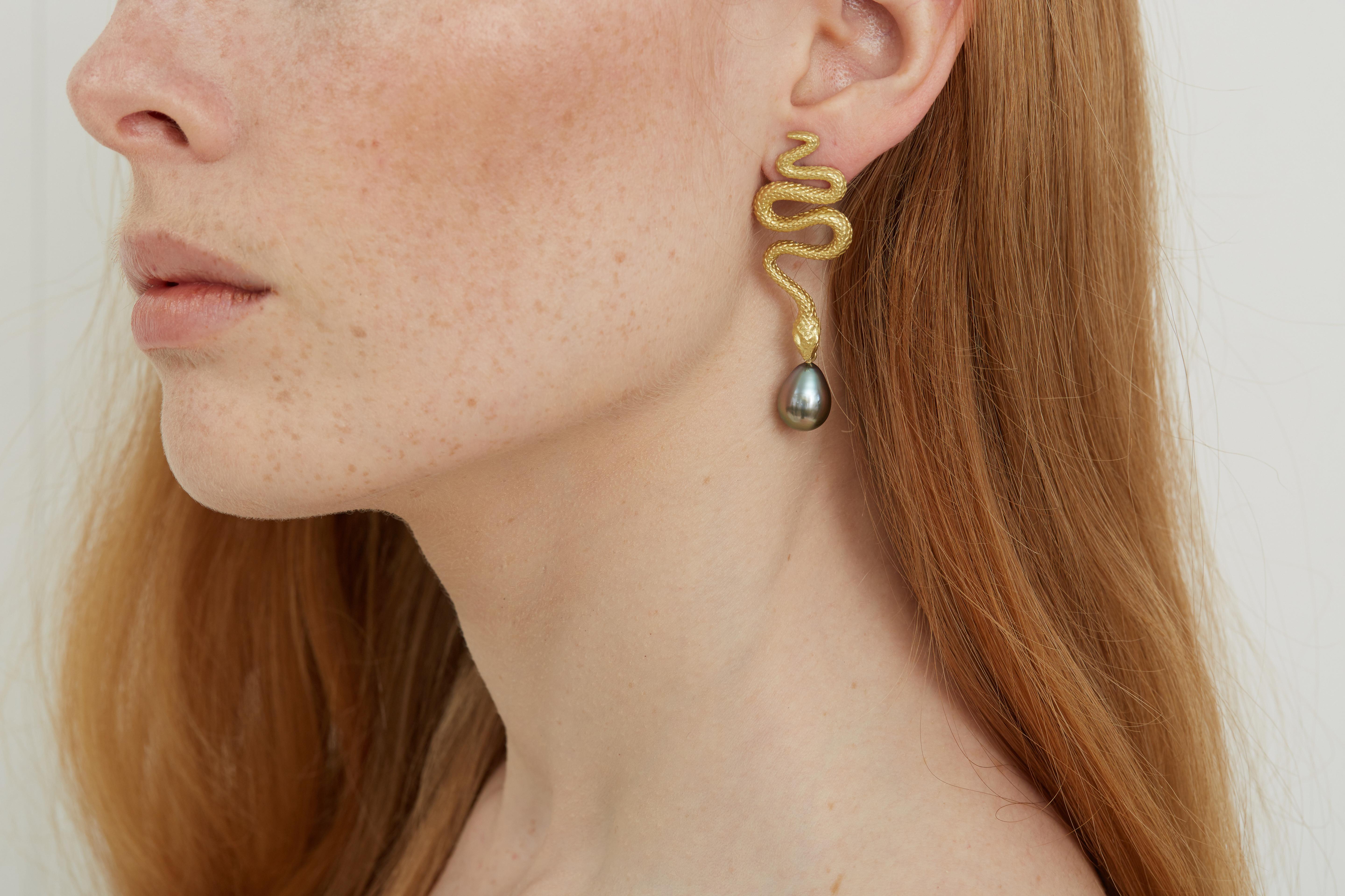 These Lilly Hastedt statement cocktail sized earrings feature large 11 mm AAA grade Tahitian pearls, Pink Spinels and 18 karat yellow Gold.   The versatility of these bold earrings from Lilly's Fauna Collection, allow them to be worn casually or