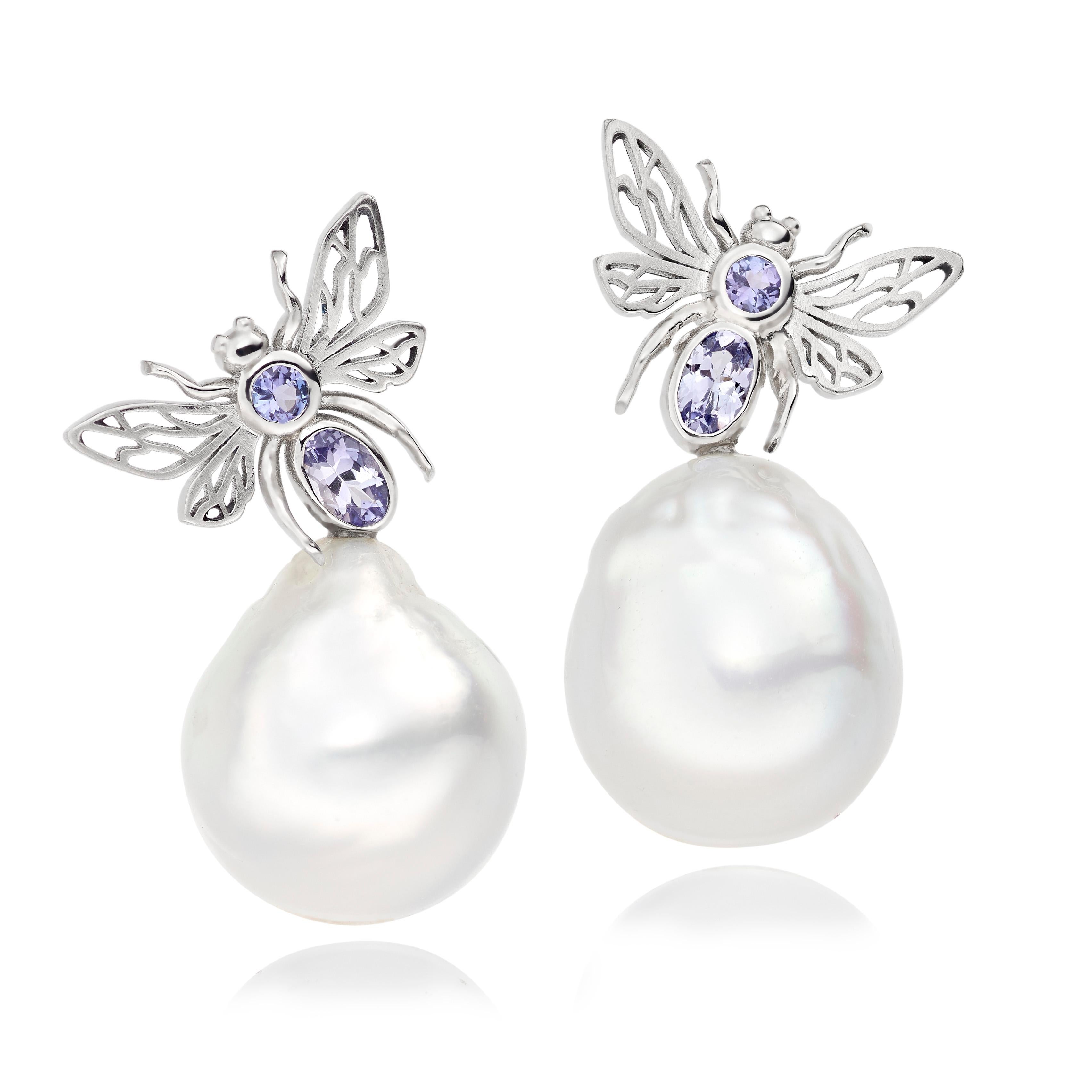 A pair of statement cocktail earrings from Lilly Hastedt's Fauna collection.  The earrings are set in Platinum with sparkling light blue Tanzanites and stunning baroque South Sea Pearls. 

Classic yet contemporary in design they will complement any