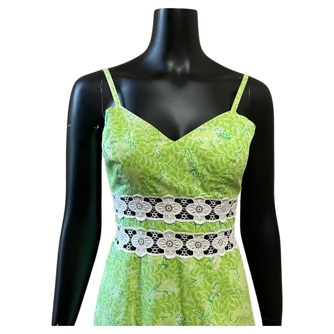 Vintage lime green and white mini dress. sheath silhouette with sweetheart neckline. cut out flower pattern midriff. adjustable spaghetti straps. woodland creatures hidden in leafy forest print. back zip closure.

Circa 1990s
Lilly Pulitzer
Tagged
